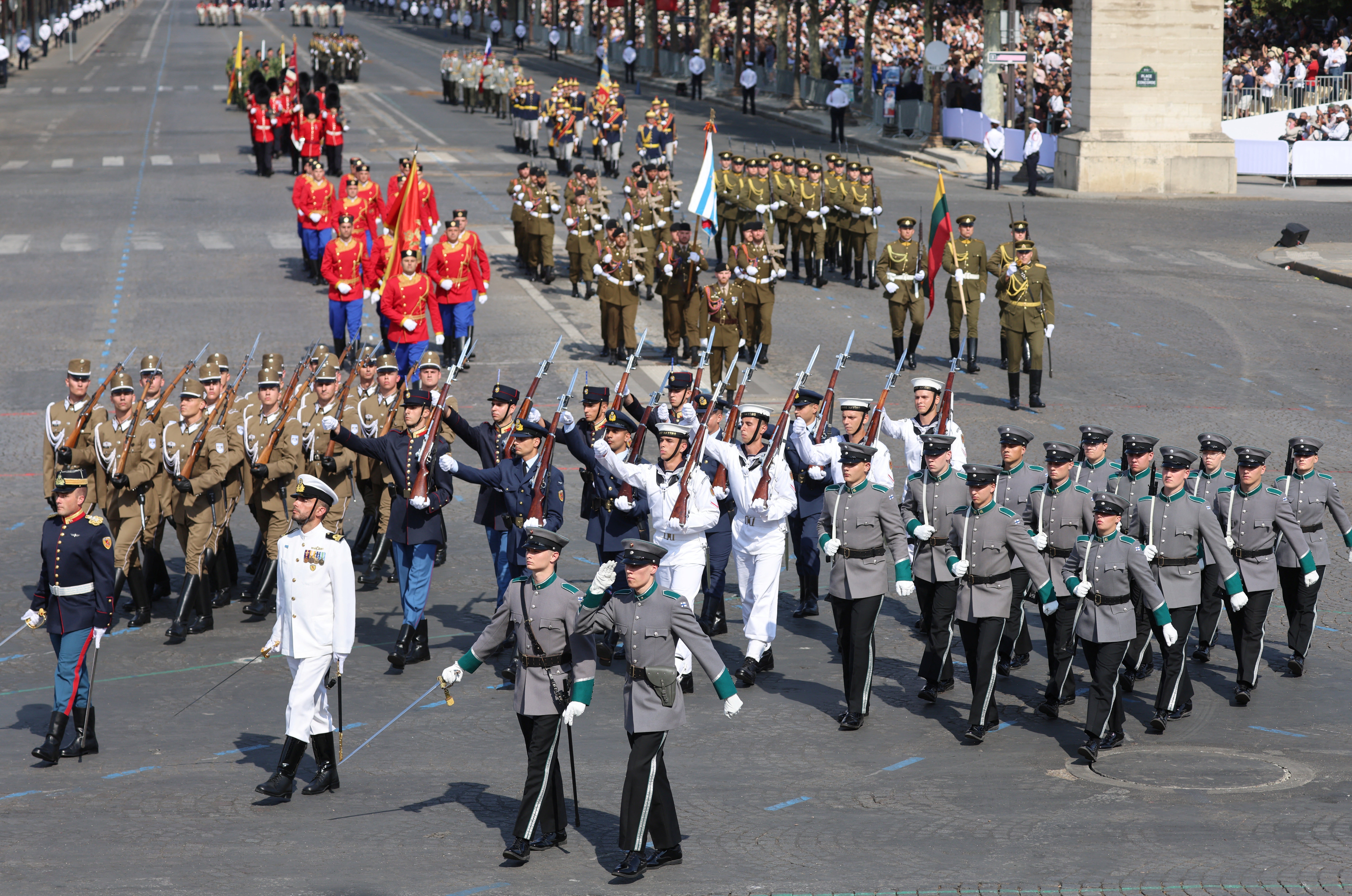 Members of the Coalition of the Willing (CoW) from Hungary, Greece and Finland march during the annual Bastille Day military parade on the Champs-Elysees Avenue in Paris (AFP/Getty)