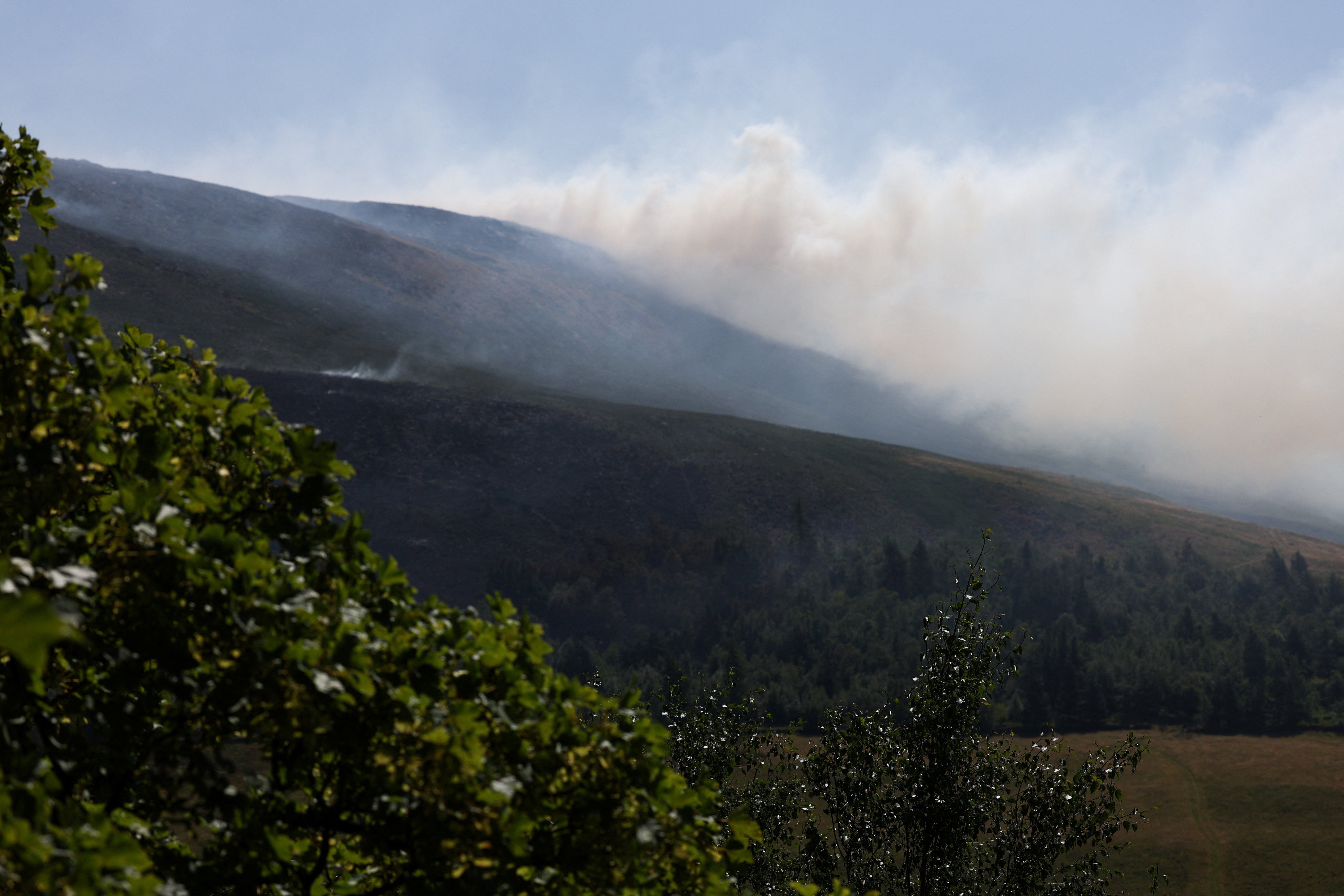 Smoke rises near the reservoir
