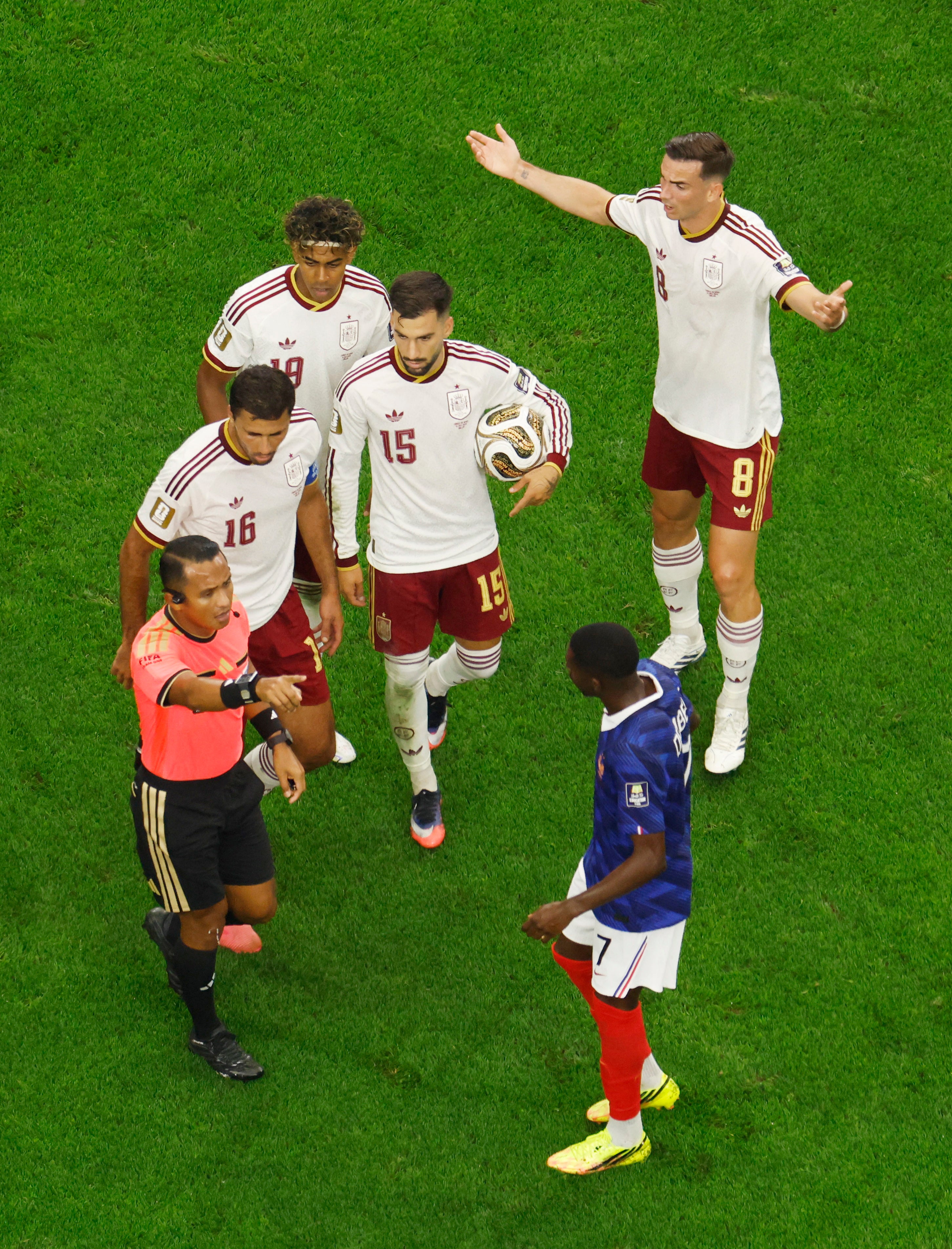 Spain's Rodri, Alex Baena, Lamine Yamal and Fabian Ruiz remonstrate with referee Ivan Barton