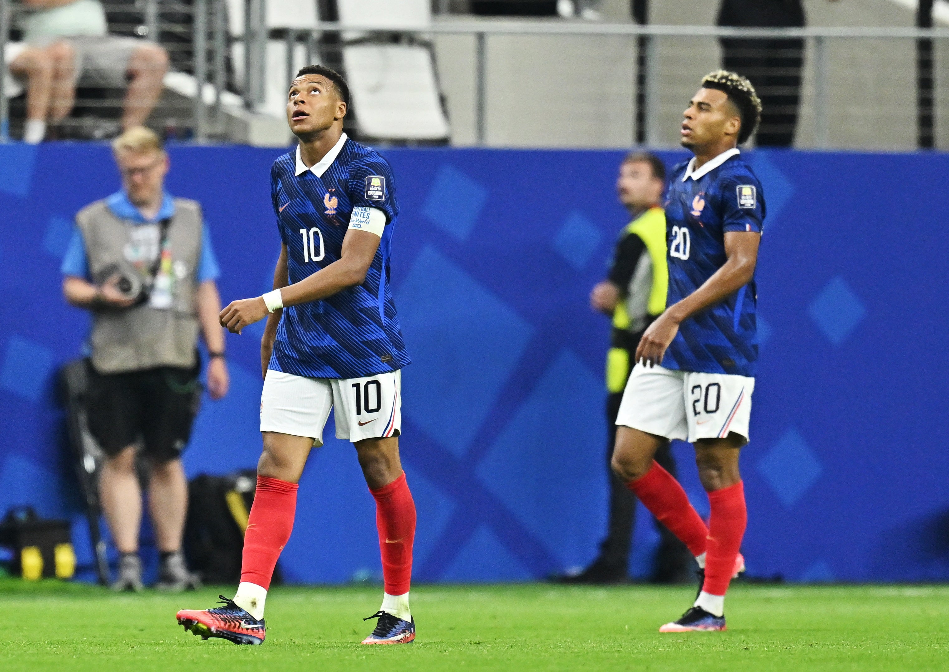 Mbappe and Doue look dejected after defeat