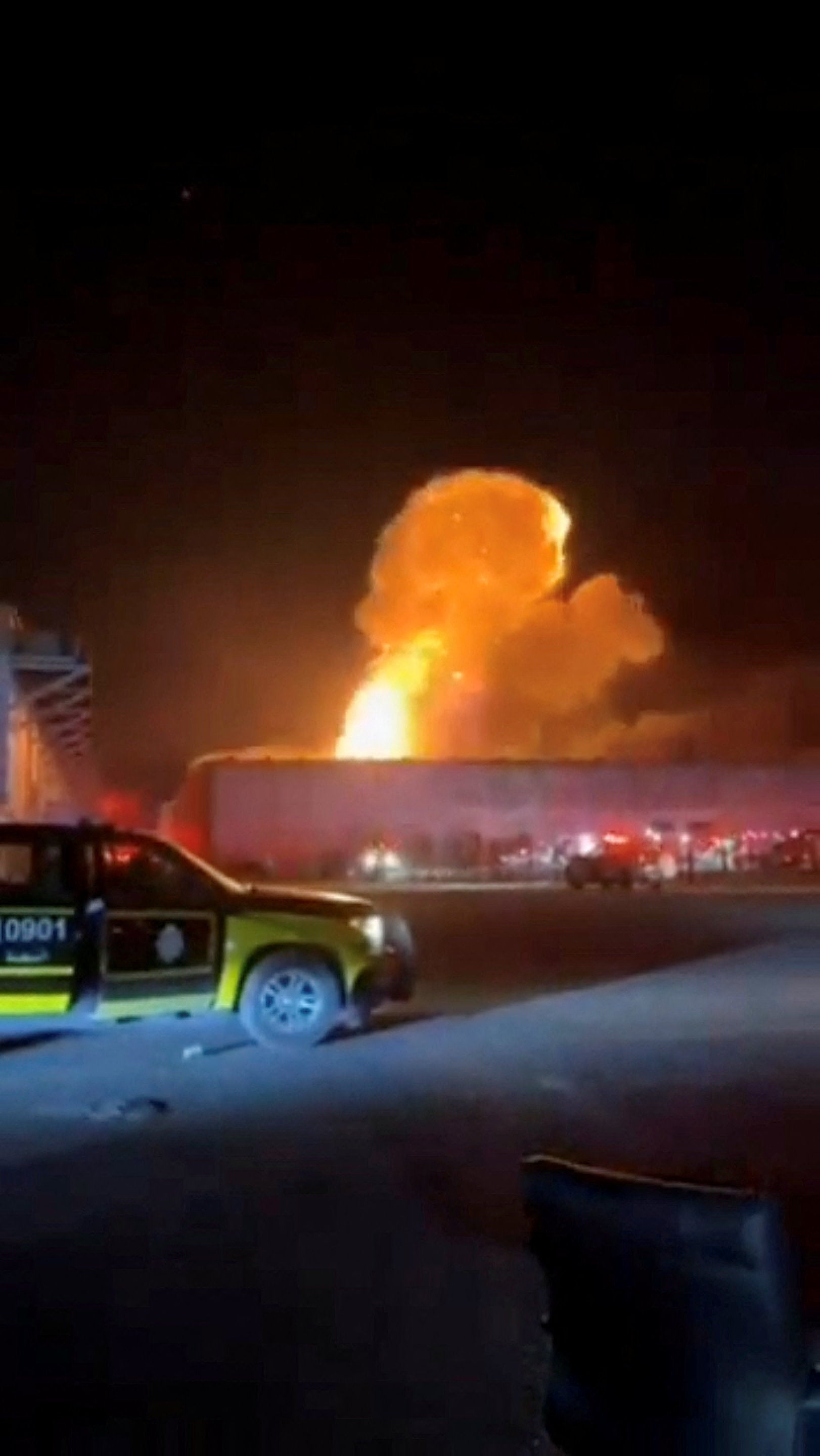 Smoke rises from an explosion following a drone strike on a warehouse in Al Shuaiba, Kuwait, in a video shared on 14 July