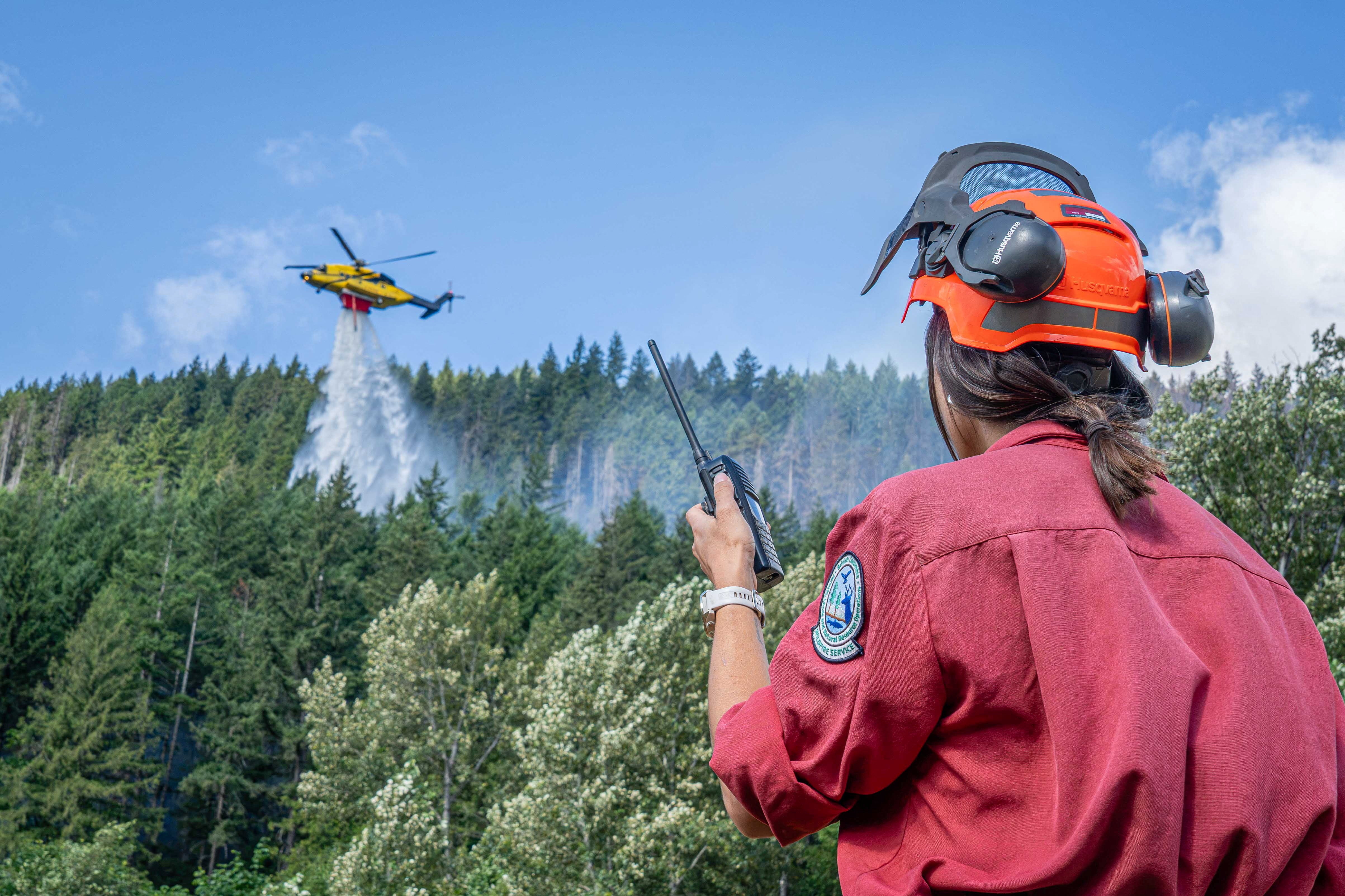 More than 830 wildfires were burning across Canada on Wednesday, sending thick smoke from major blazes in Ontario into the U.S. Pictured is the Brunswick Complex wildfire near North Bend, British Columbia, on Sunday