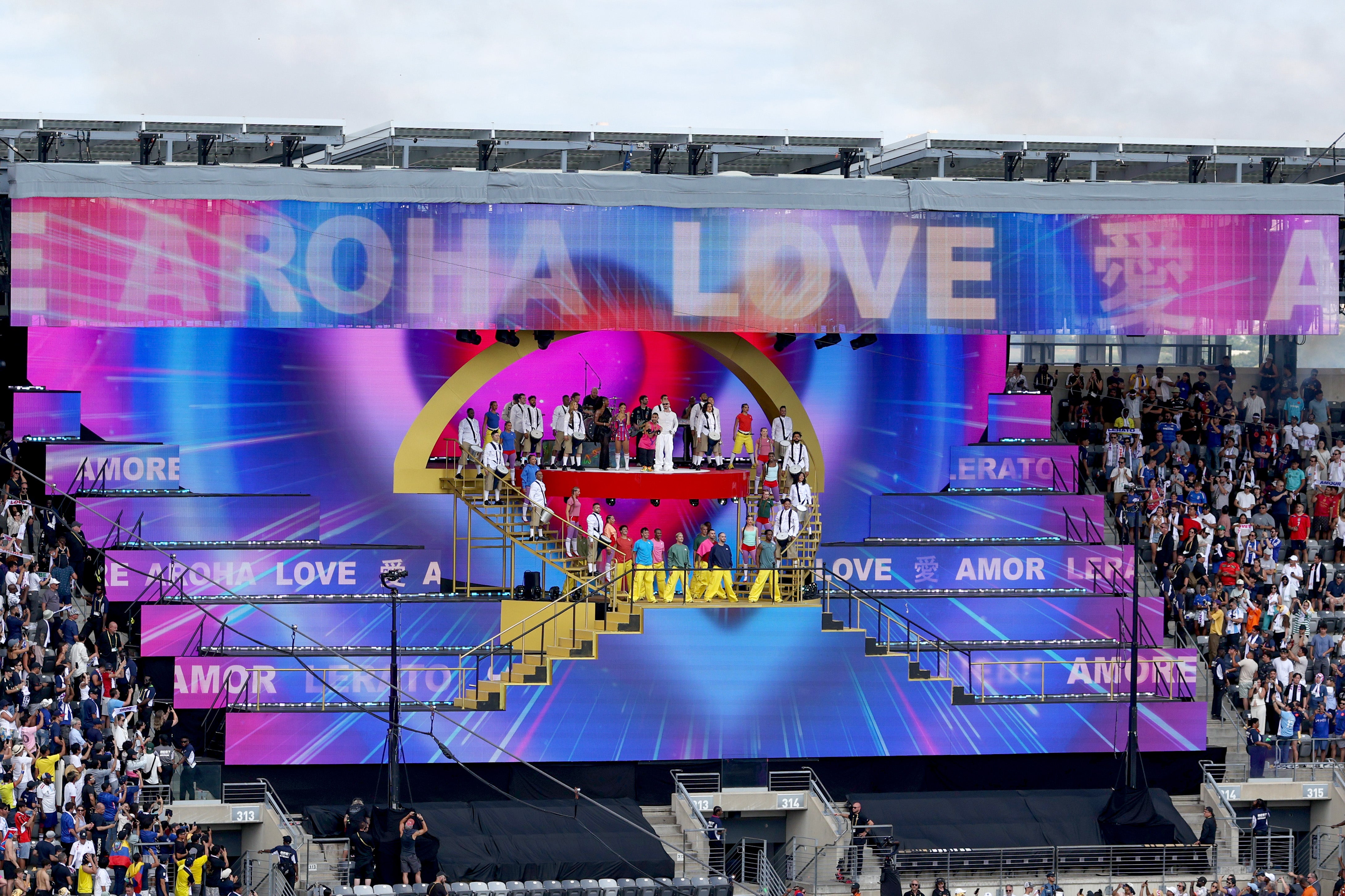 Chris Martin of Coldplay and Emmanuel Kelly perform during the halftime show during the FIFA Club World Cup 2025 Final match between Chelsea FC and Paris Saint-Germain