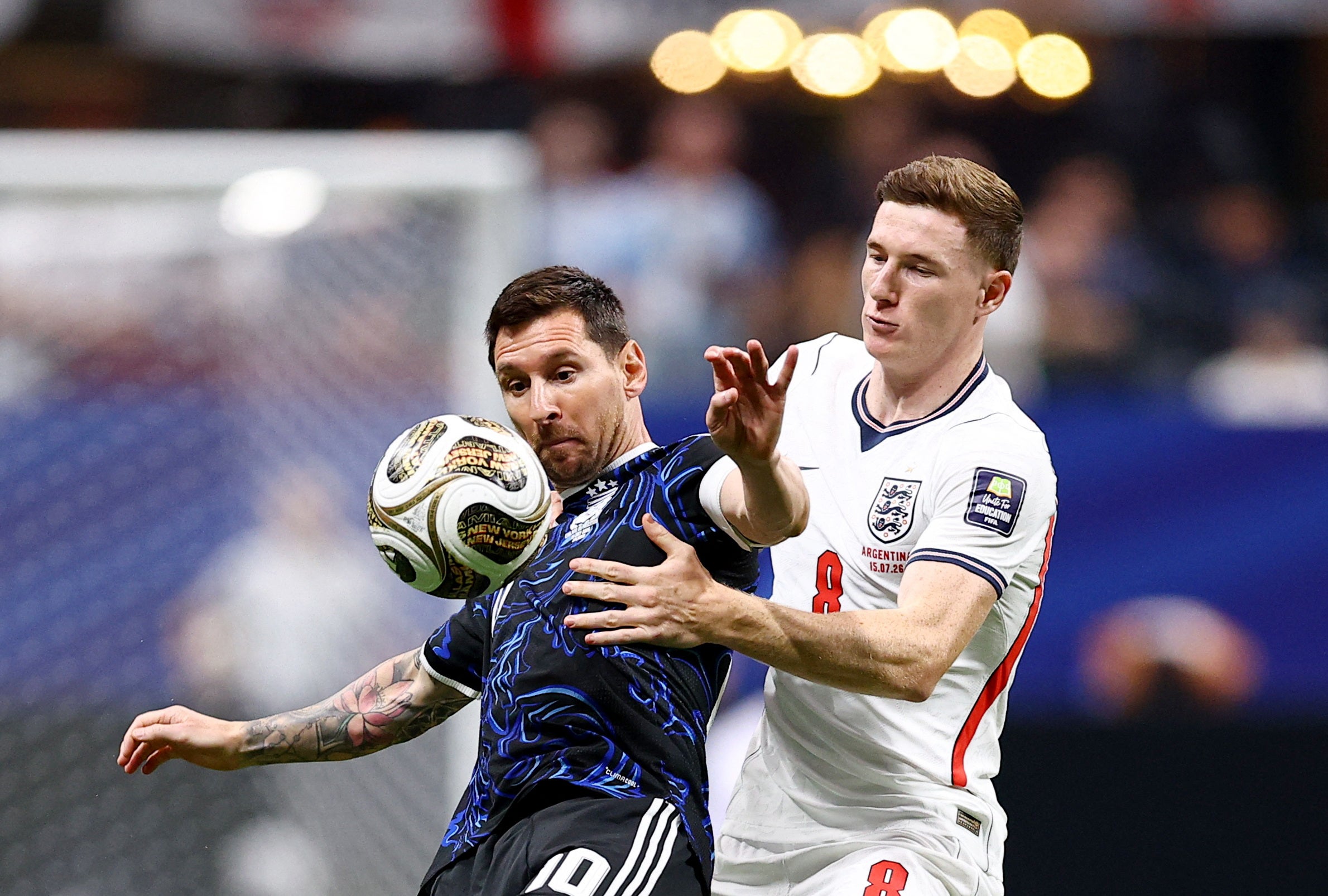 Messi battles England’s Elliot Anderson in midfield