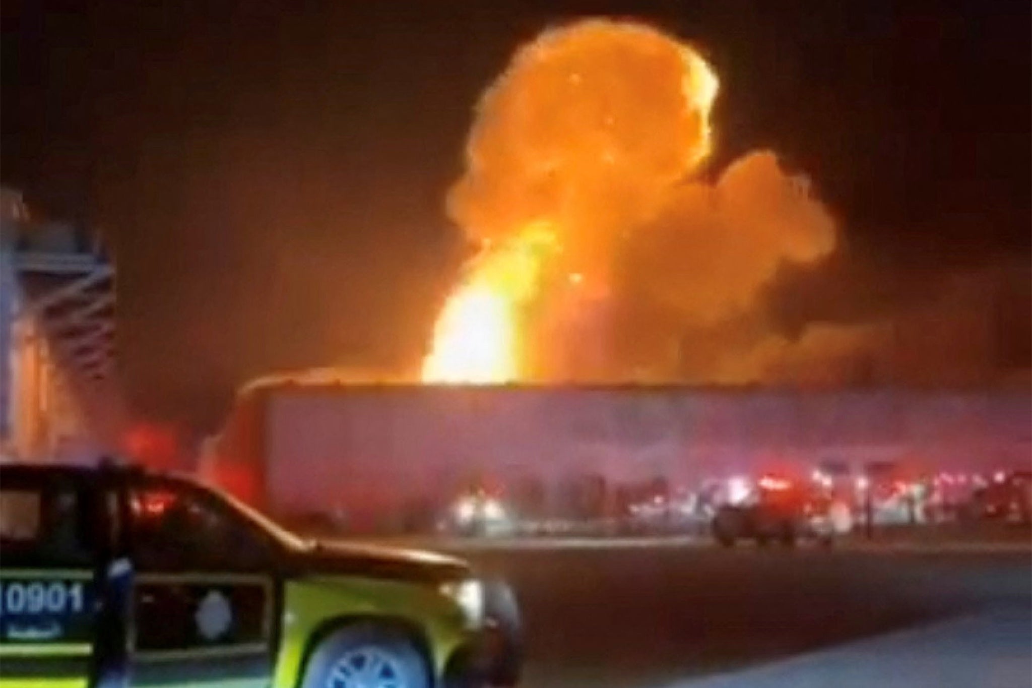 Smoke rises from an explosion following a drone strike on a warehouse in Al Shuaiba, Kuwait, in this still image obtained from social media video released July 14