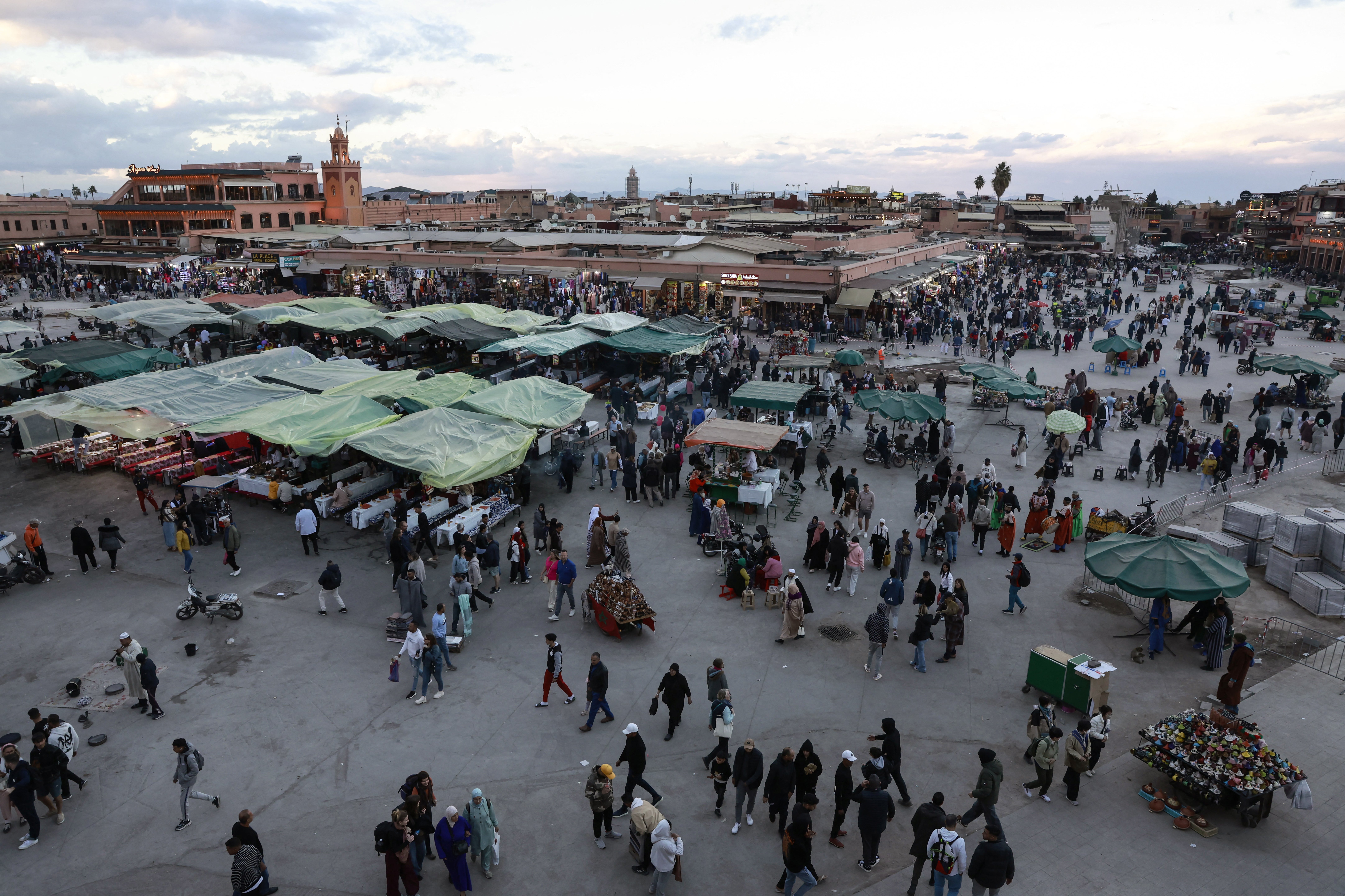 Locals and tourists gather for food and entertainment in Jemaa el-Fna Square or Jamaa Lafna, listed as UNESCO Cultural Heritage site, located in the heart of the Medina of the city of Marrakech on November 30, 2025. (Photo by Abdel Majid BZIOUAT / AFP via Getty Images) (AFP/Getty)