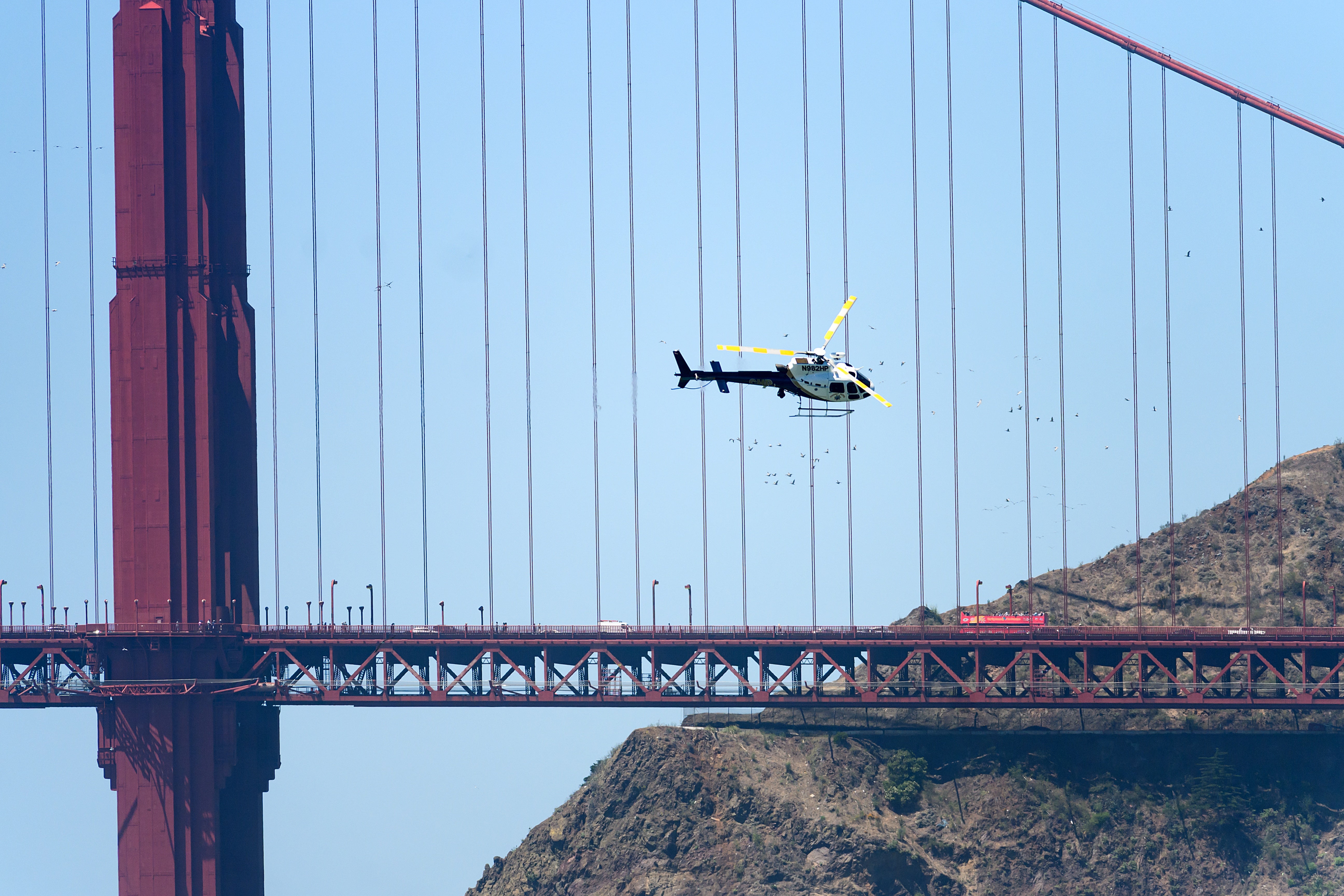 Coast Guard crews suspended their search late Wednesday for three people missing a day after a boat capsized in the cold, choppy waters of San Francisco Bay (AP)