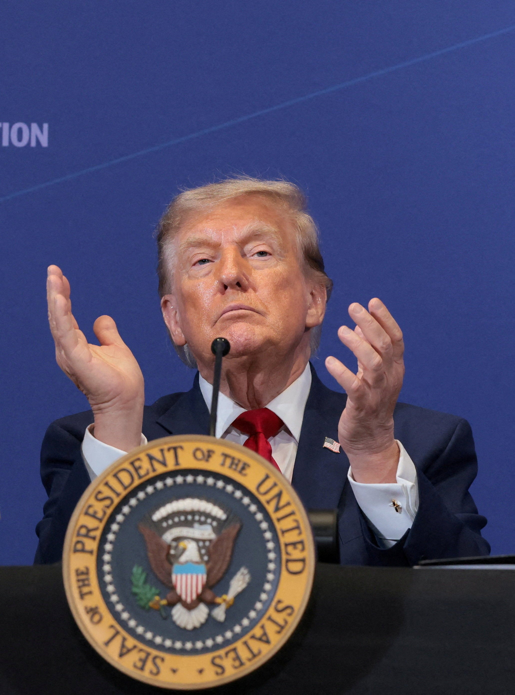 President Donald Trump applauds at the Pennsylvania Defense and Innovation Summit at the United States Army War College in Carlisle, Pennsylvania