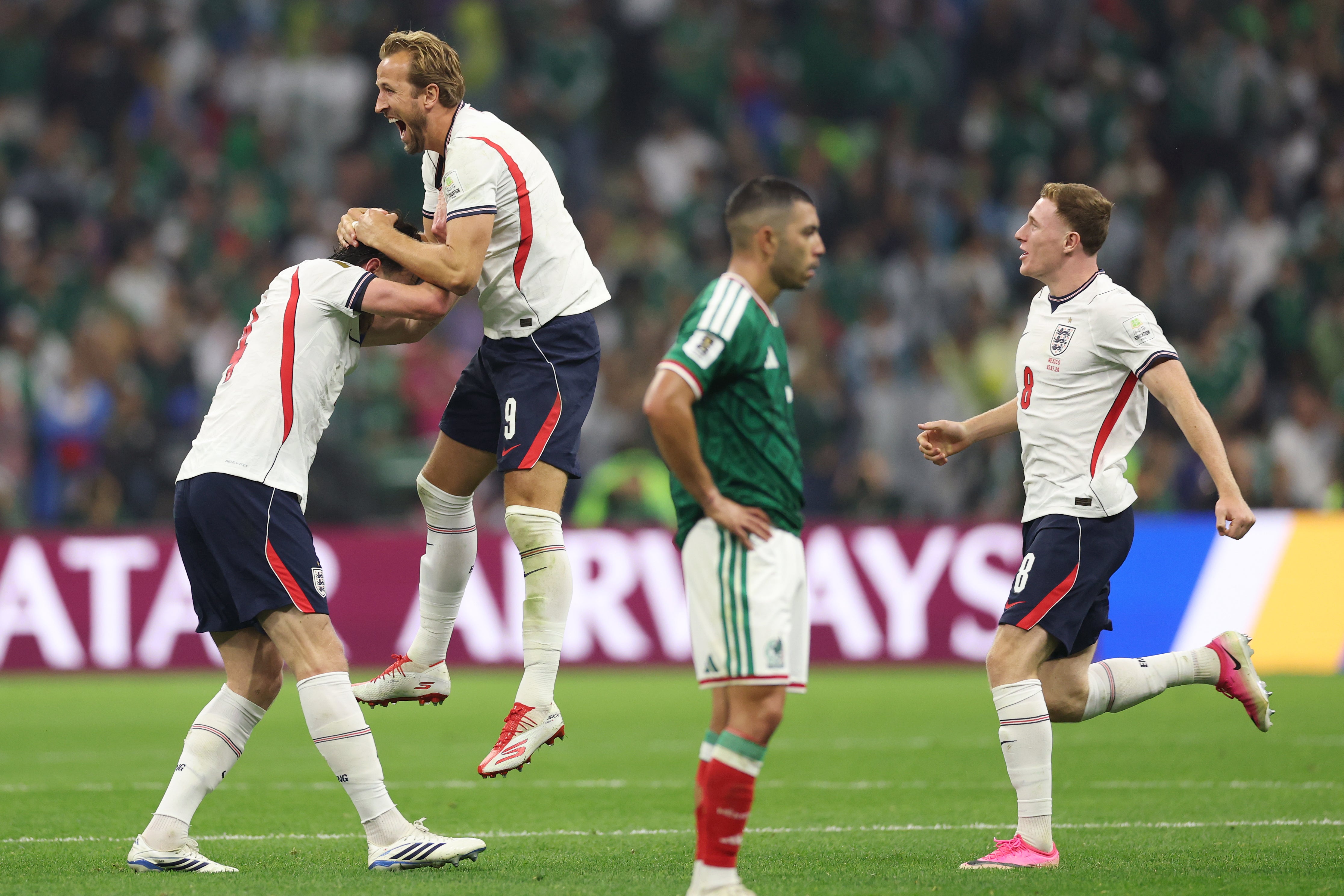 England celebrate the full-time whistle after beating Mexico in the round of 16