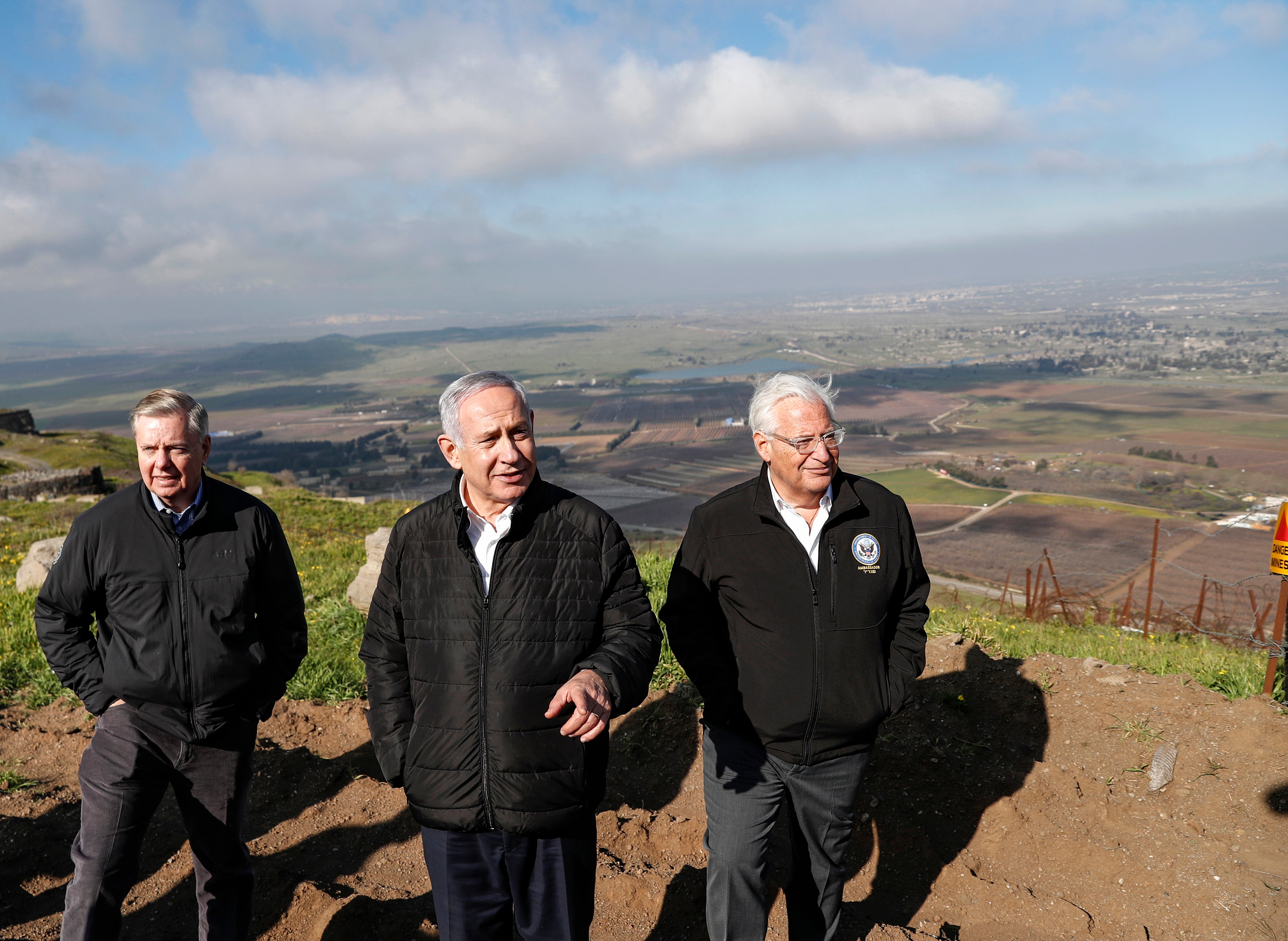 (L to R) US Senator Lindsey Graham (R-SC) is accompanied by Israeli Prime minister Benjamin Netanyahu and US Ambassador to Israel David Friedman as they visit the border line between Syria and the Israeli-annexed Golan Heights on March 11, 2019.