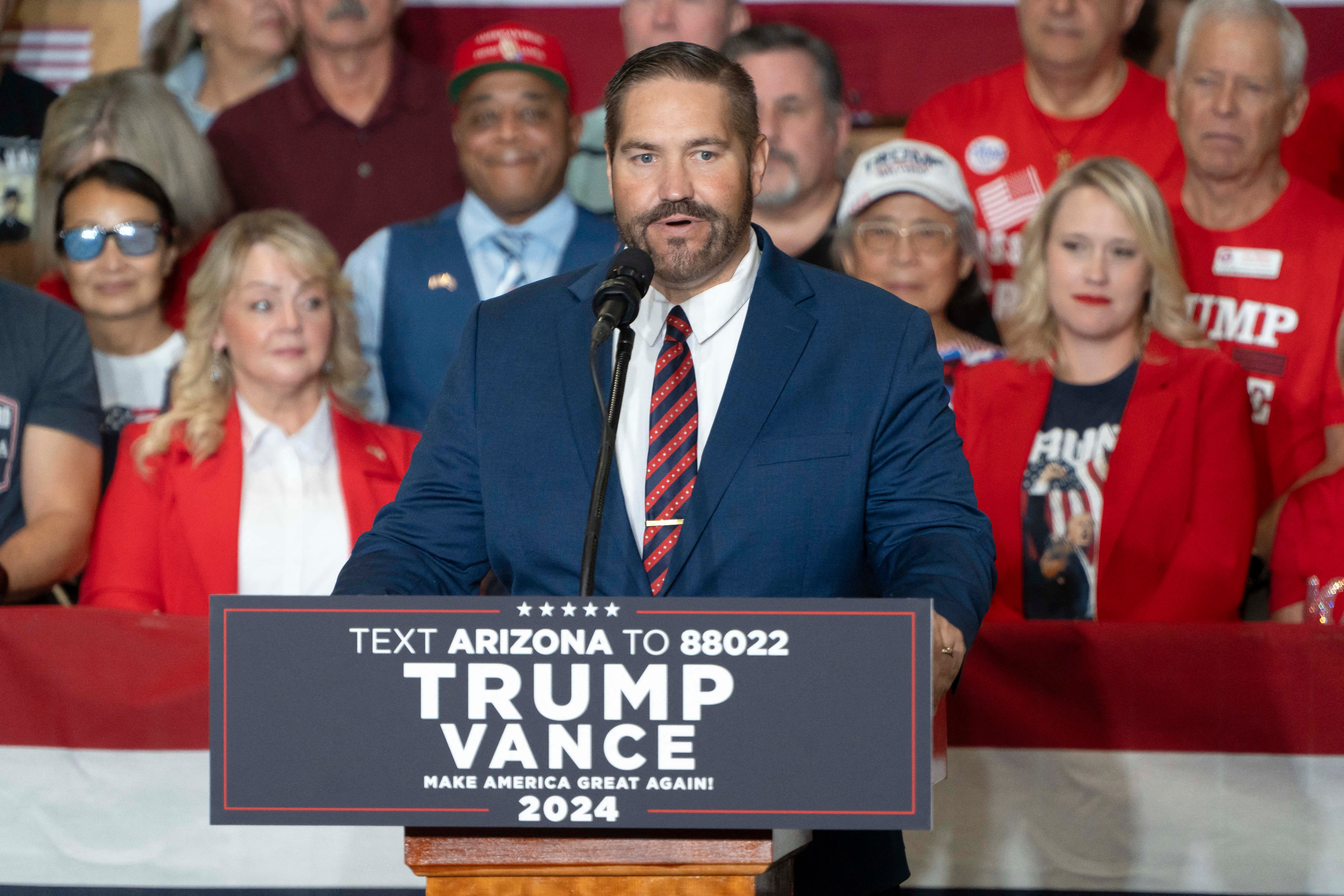 Arizona State Representative and Republican candidate for Maricopa County Recorder Justin Heap speaks during a campaign rally with US Republican vice presidential nominee Ohio Senator J.D. Vance at TYR Tactical in Peoria, Arizona, on October 22, 2024