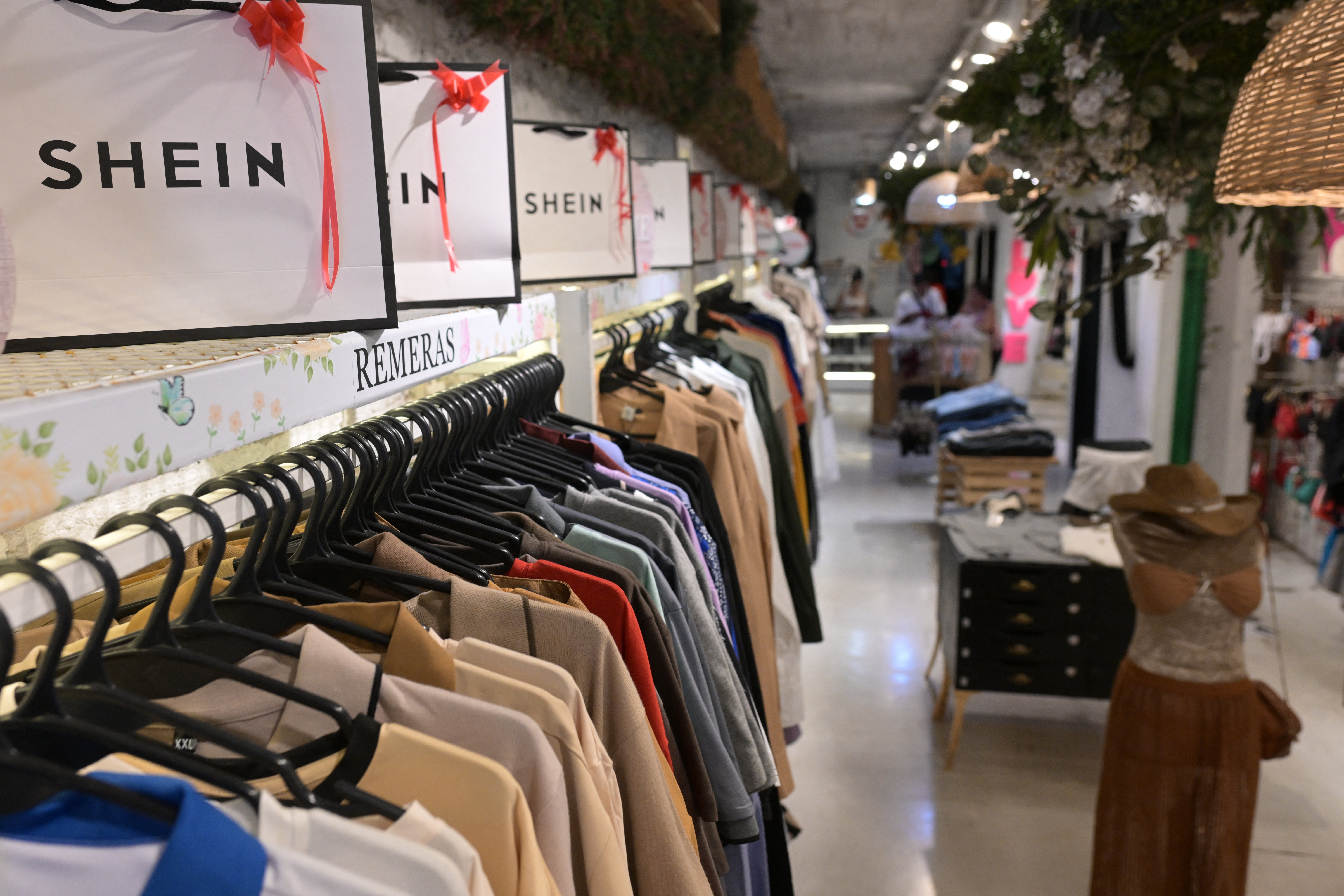 Upcoming second-quarter earnings reports from major retailers like Walmart, Target, and Macy’s next month are expected to provide further insights into shopping behavior (AFP/Getty)