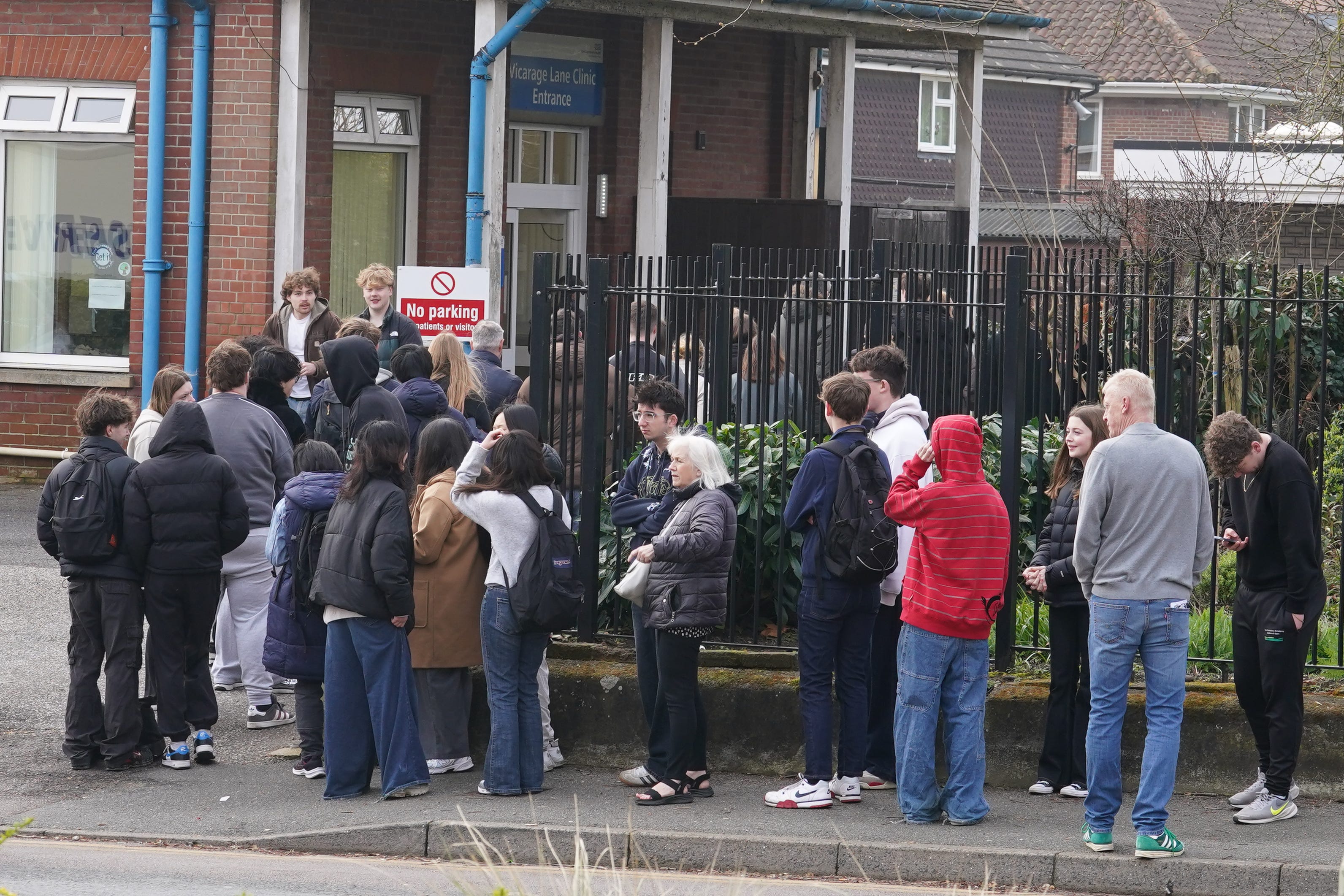 People wait in line outside a meningitis vaccination hub at the Vicarage Lane Clinic in Ashford, Kent (Gareth Fuller/PA) (PA Wire)