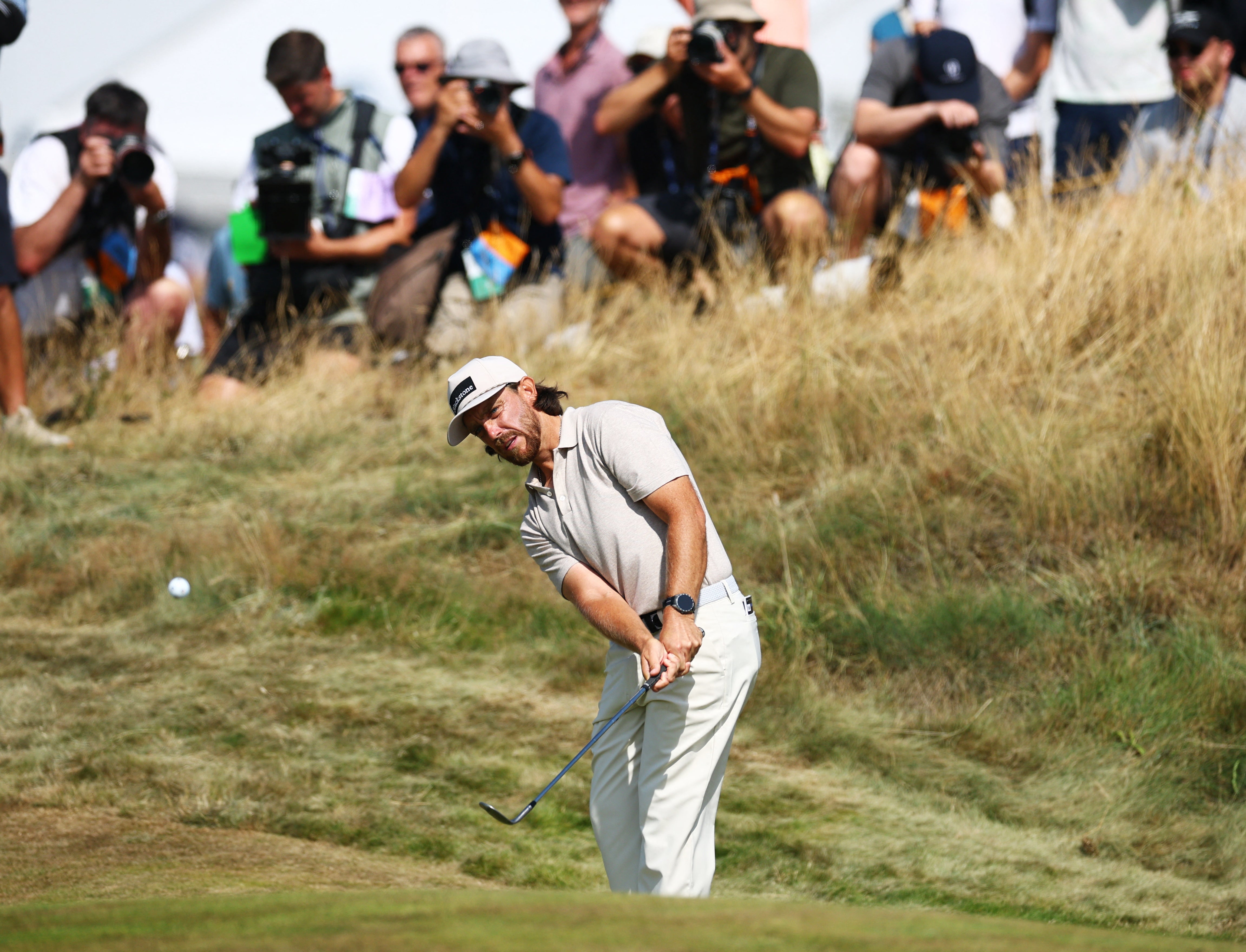 Crowds packed to watch Fleetwood by his was one over by the 12th (Reuters)