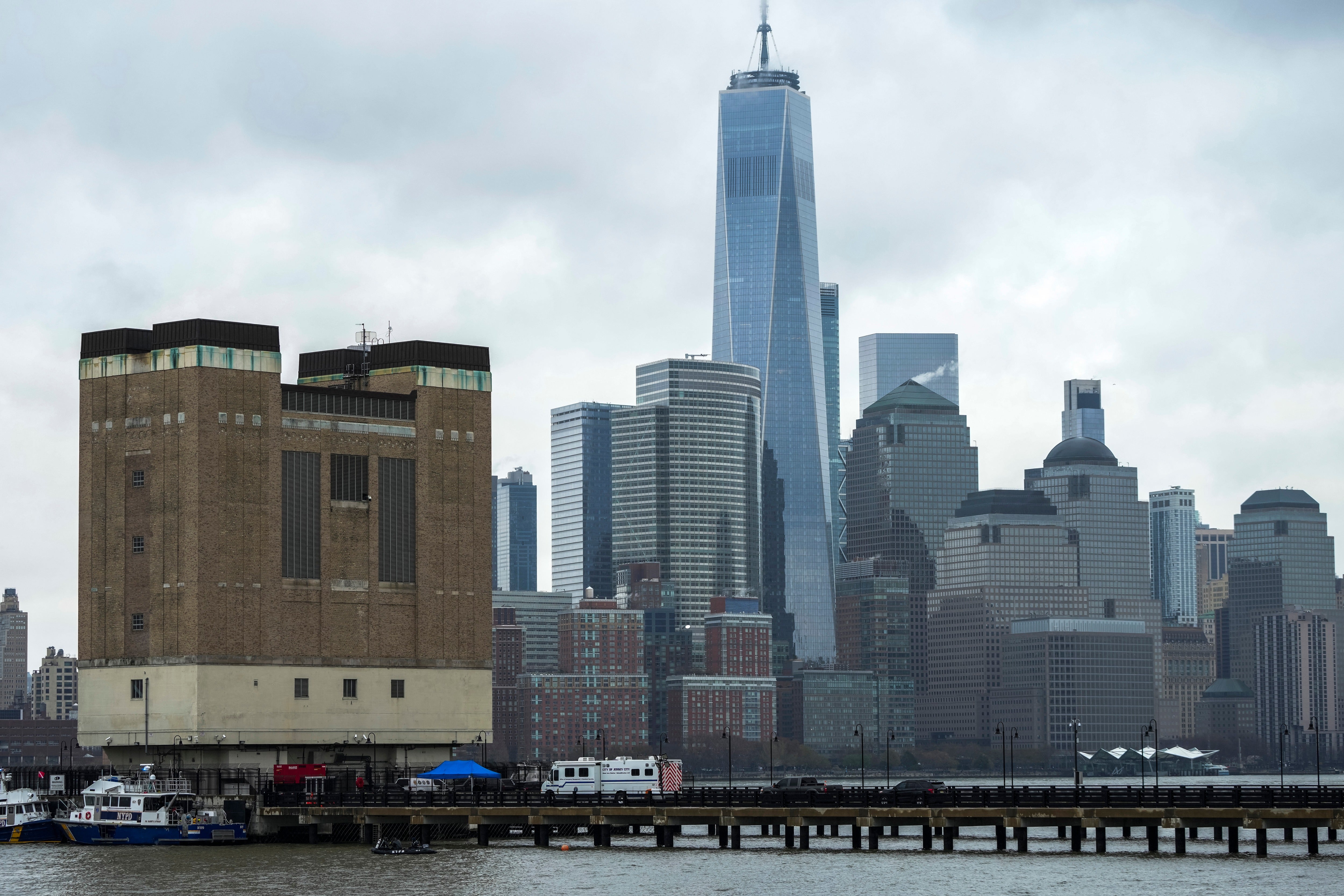 NYPD scuba divers team search next to the site of the crashed helicopter on April 11, 2025