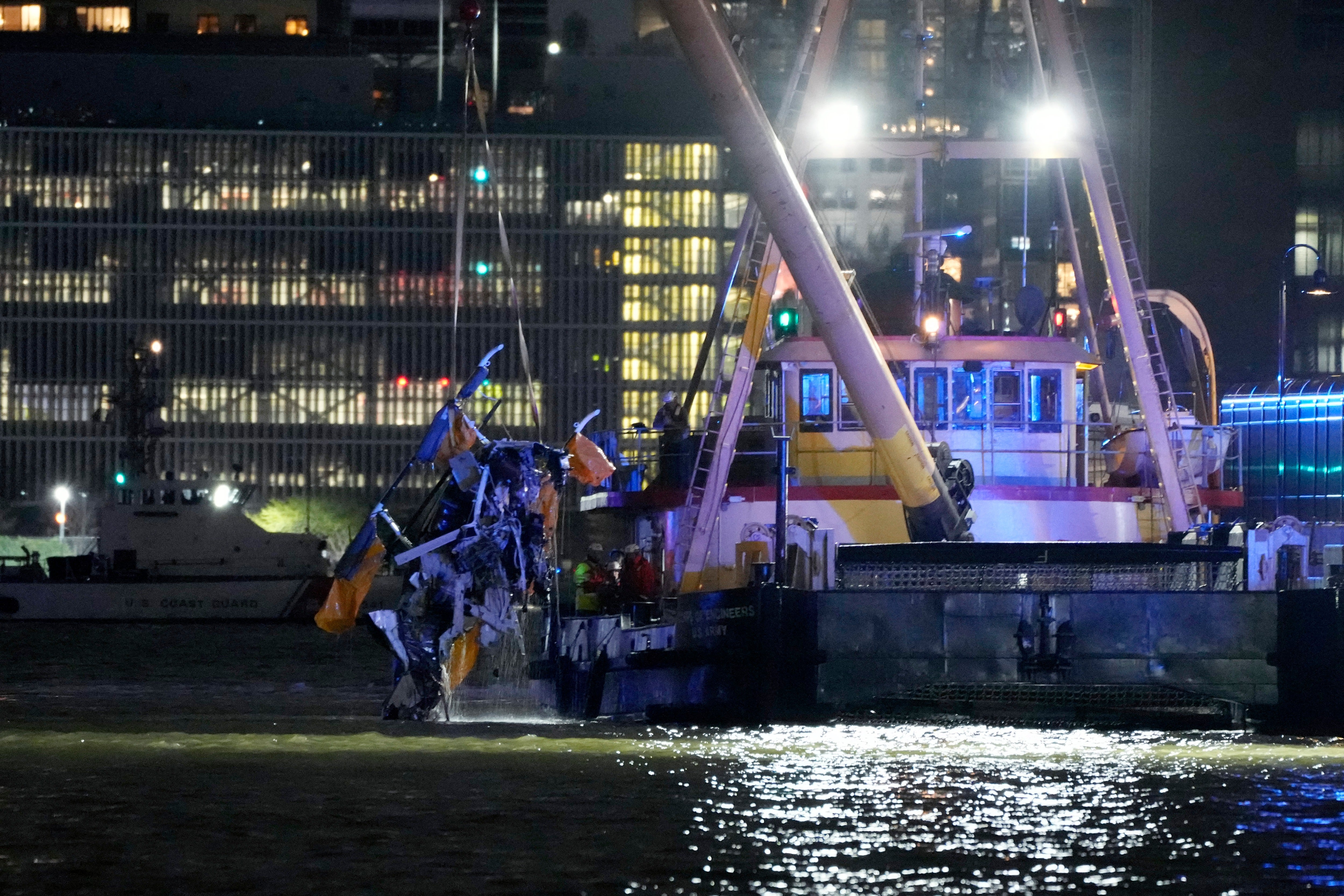 The helicopter wreckage is removed from the water after crashing into the Hudson River