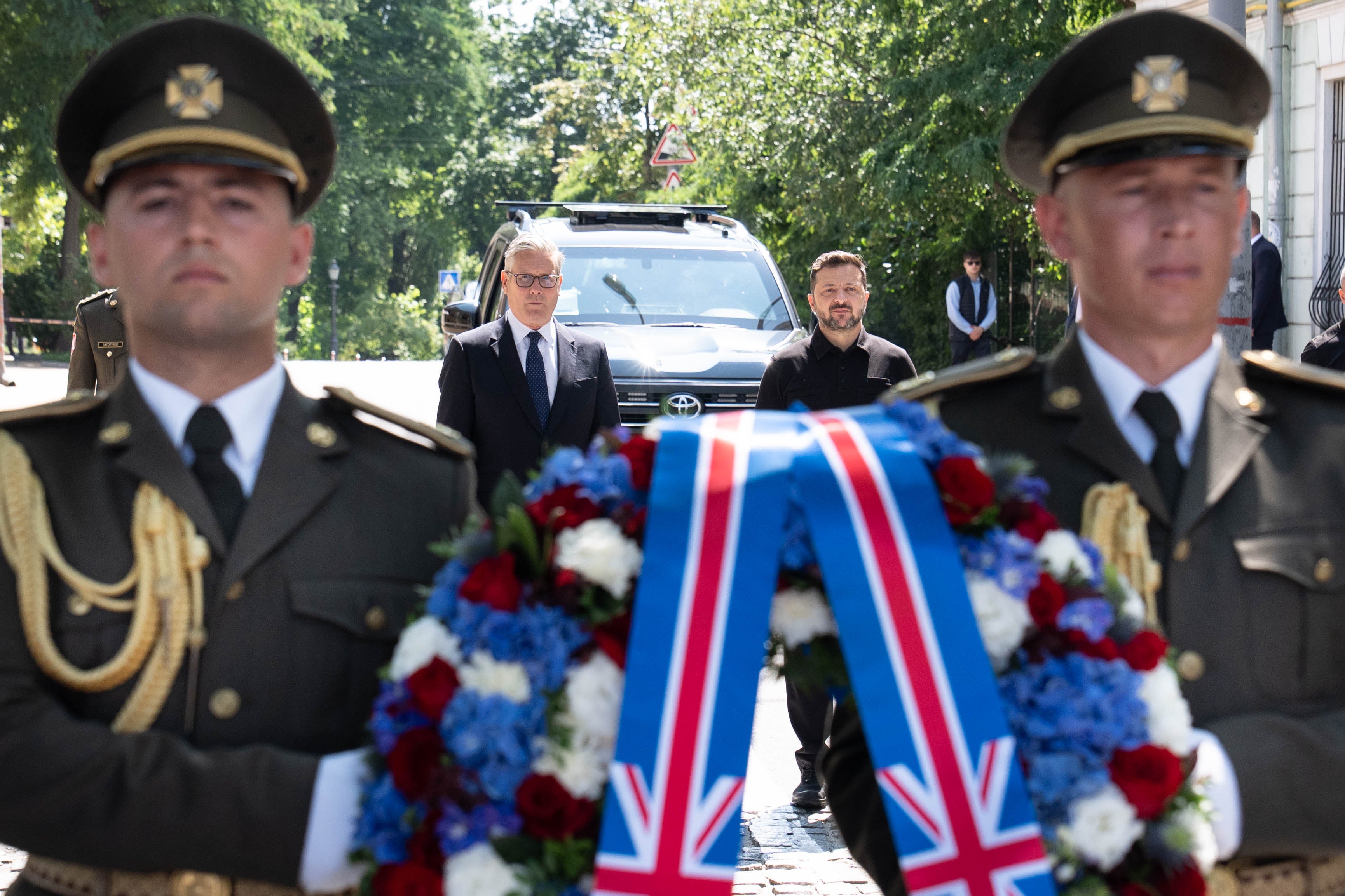 Prime Minister Sir Keir Starmer and Ukrainian President Volodymyr Zelensky pay their respects at a wreath laying at the Wall of Remembrance of the Fallen for Ukraine (Stefan Rousseau/PA)