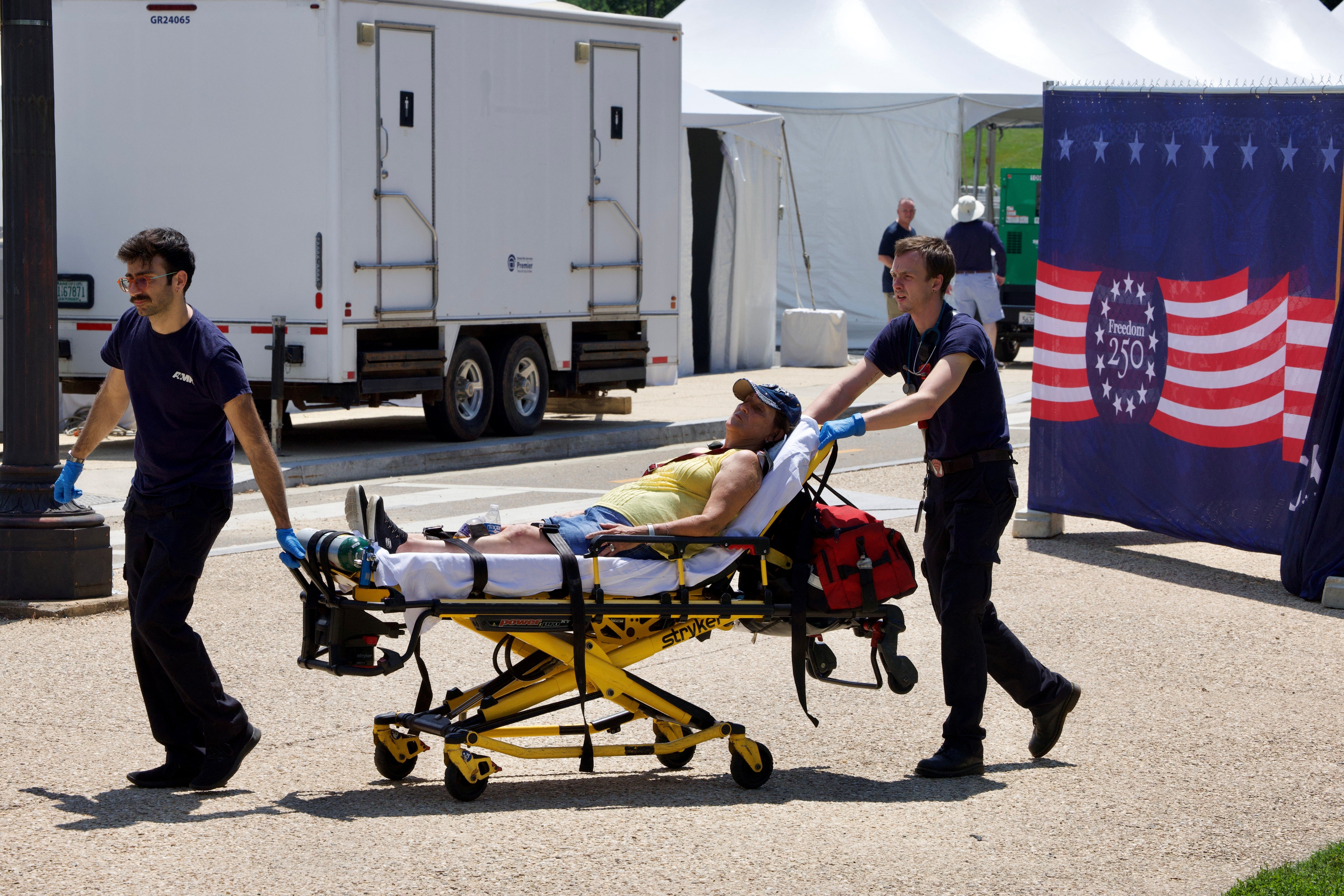 A person is helped by first responders along the National Mall in Washington, D.C., earlier this month. Heat is responsible for 2,000 deaths each year