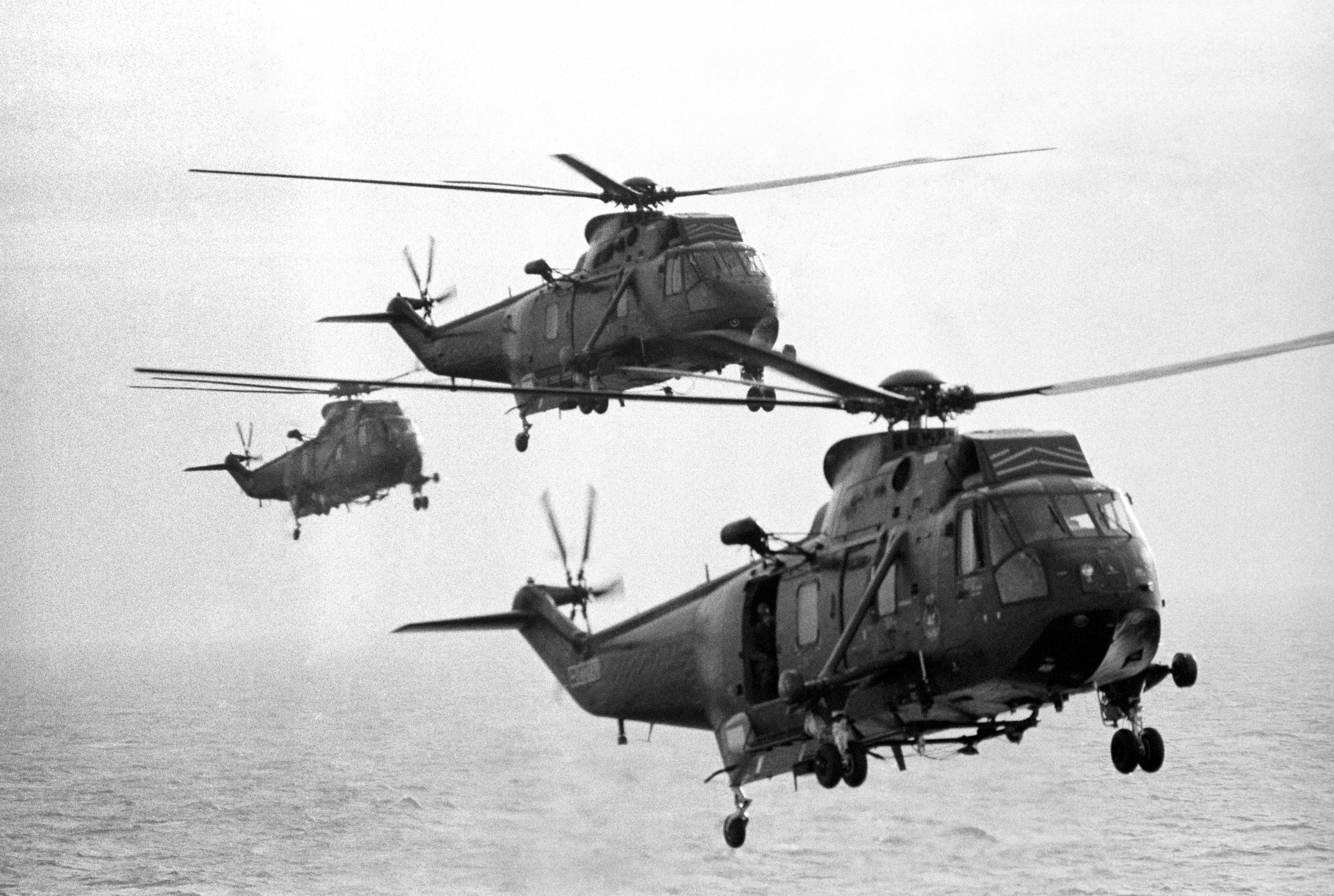 Sea king helicopters from the carrier HMS Hermes flying in formation during a practice sortie from the vessel as she makes her way south with the British naval task force heading for the Falkland Islands following the Argentinian invasion