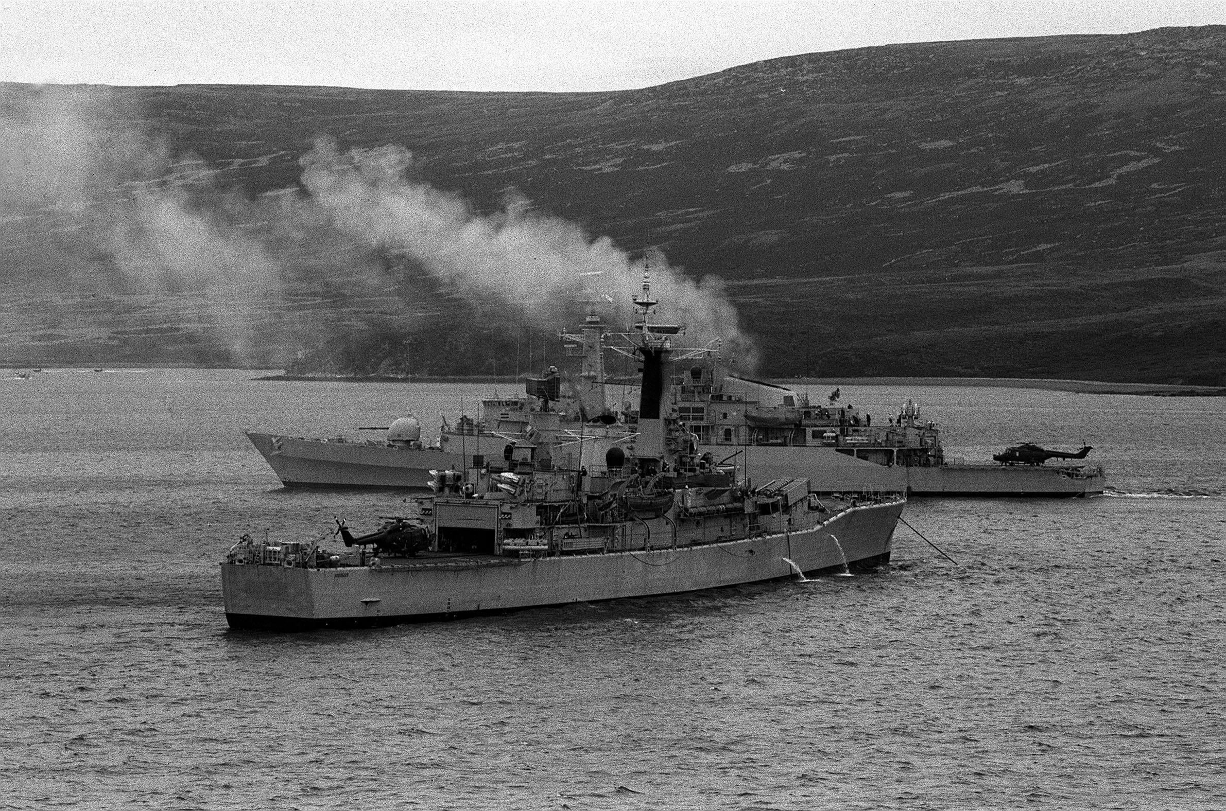 A Royal Navy ship moored near HMS Antelope (background) in Ajax Bay the day before she exploded and sank. Antelope was hit by an Argentinian Exocet missile which later exploded while an attempt was being made to defuse it
