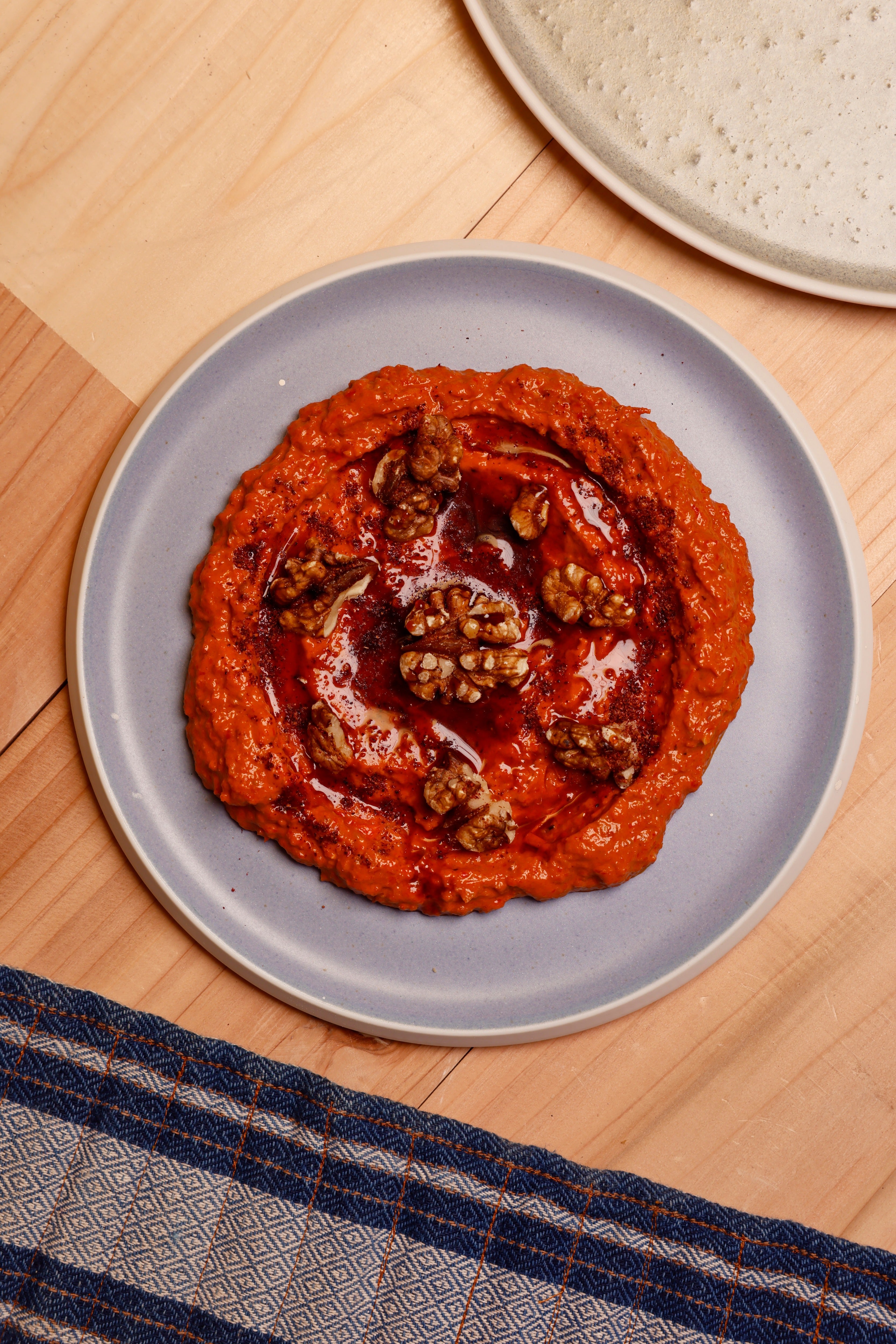 Charred peppers, walnuts and pomegranate molasses bring sweetness, smoke and sharpness