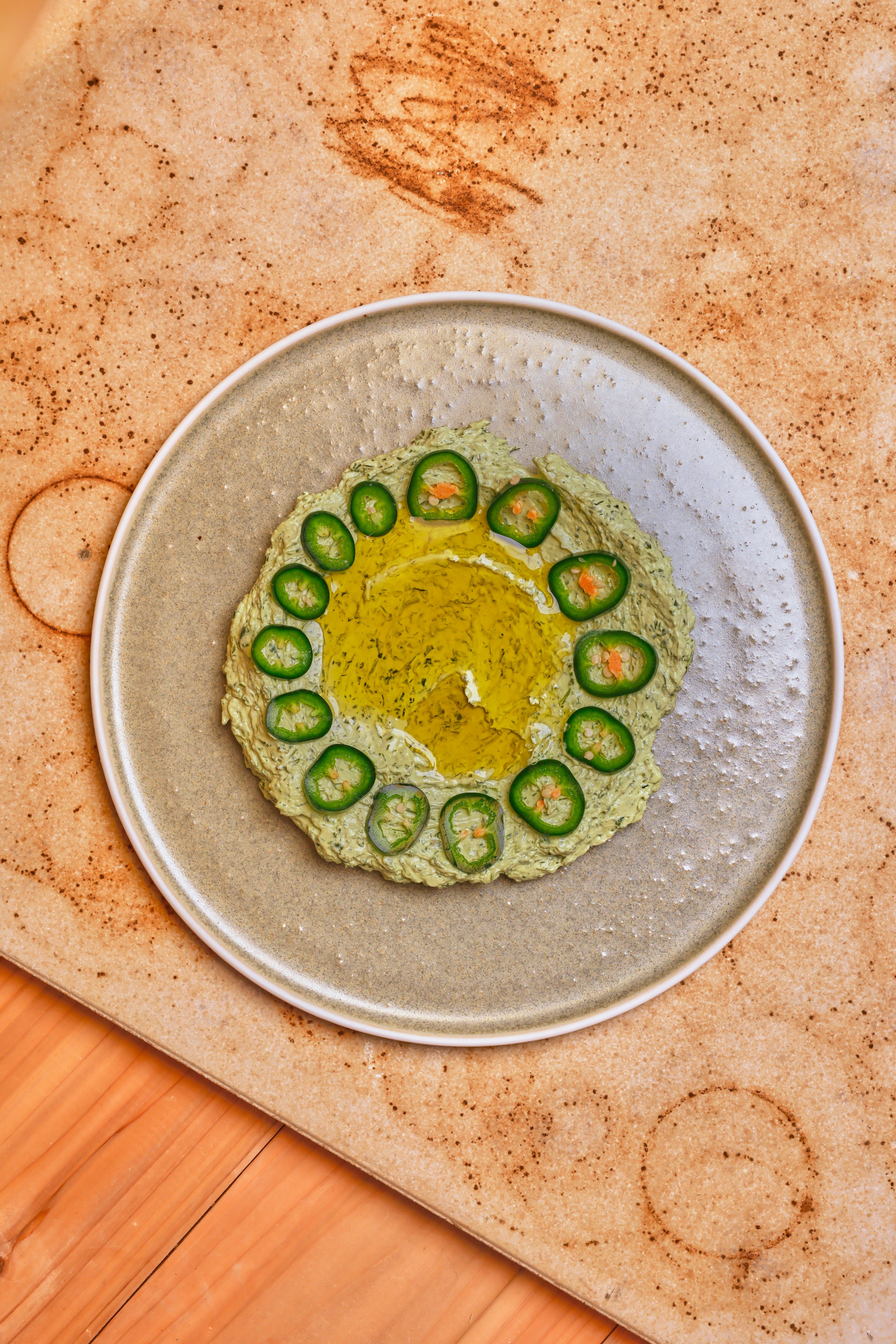 Thick, tangy labneh brightened with fresh herbs, jalapeño and a generous pour of olive oil