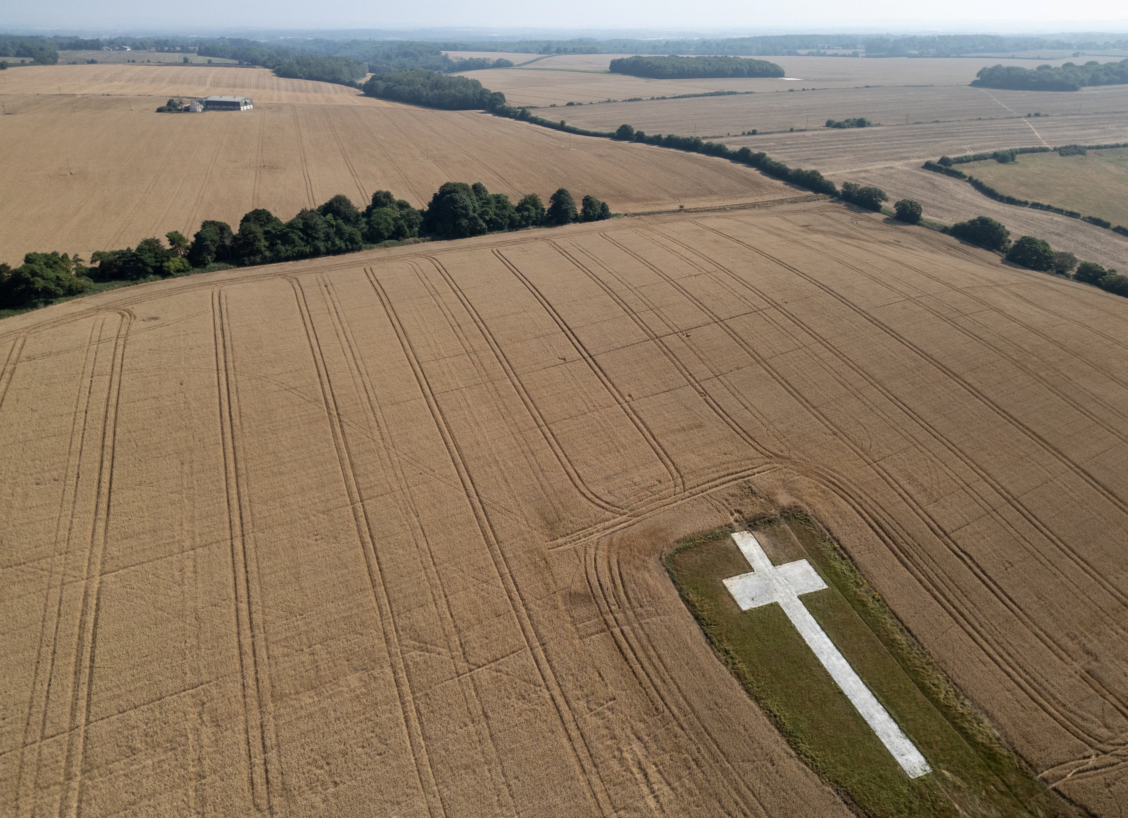 A drone view shows the Lenham Cross sitting amongst a dried-out landscape as prolonged hot weather and heatwaves continue across the country, in Lenham, Britain, July 17, 2026.