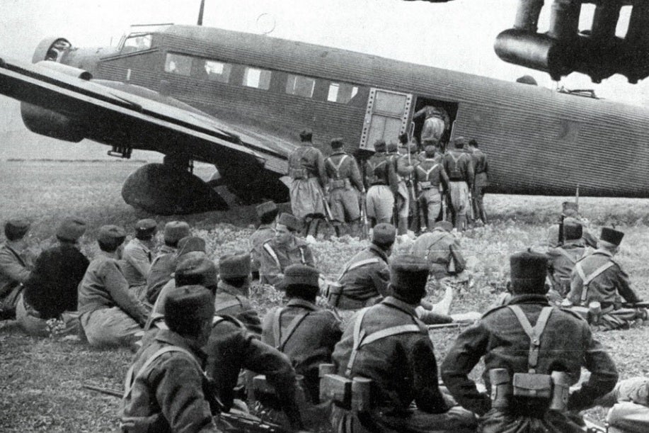This image shows Spanish rebel troops queuing to board a German plane to take them from Spanish northern Morocco to Spain