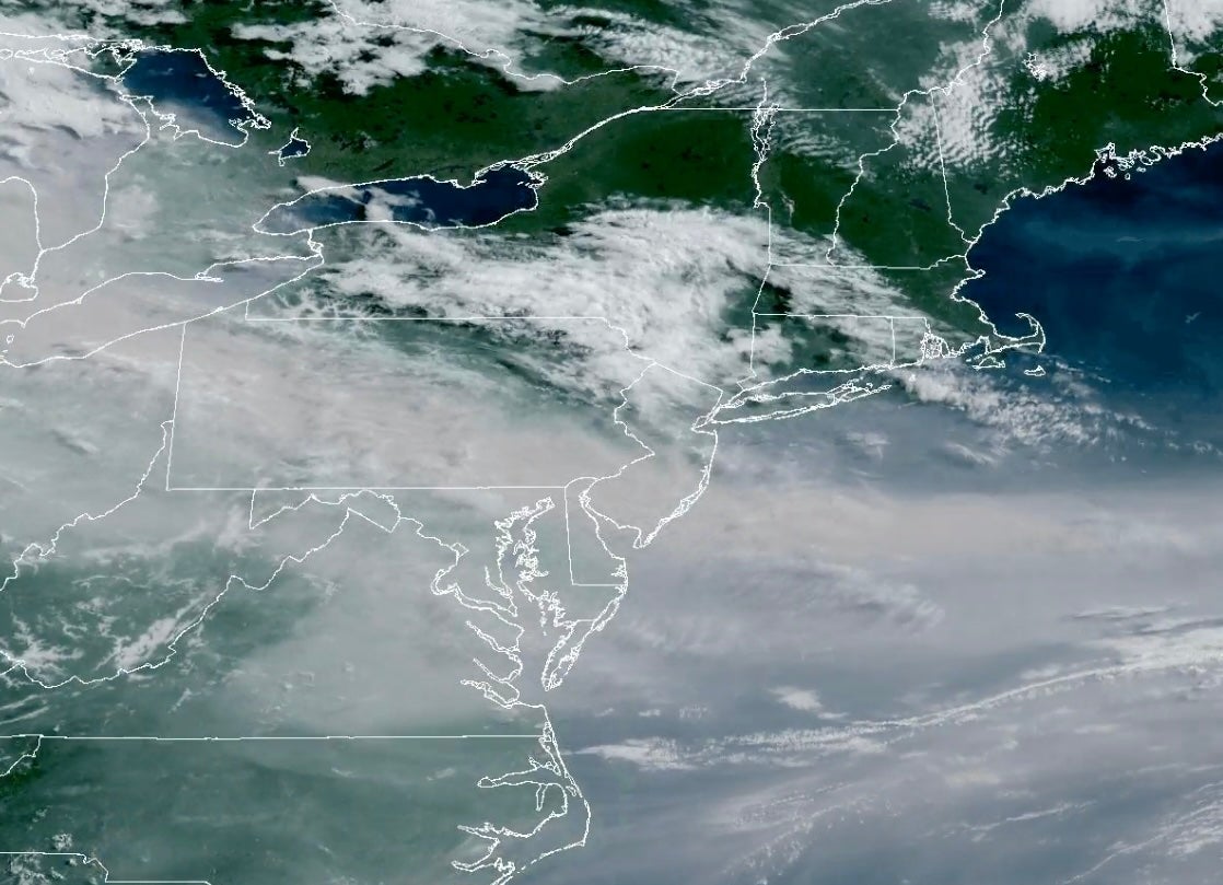 A satellite image shows Canadian wildfire smoke lingering across the eastern U.S. Friday. The smoke impacts are forecast through Saturday