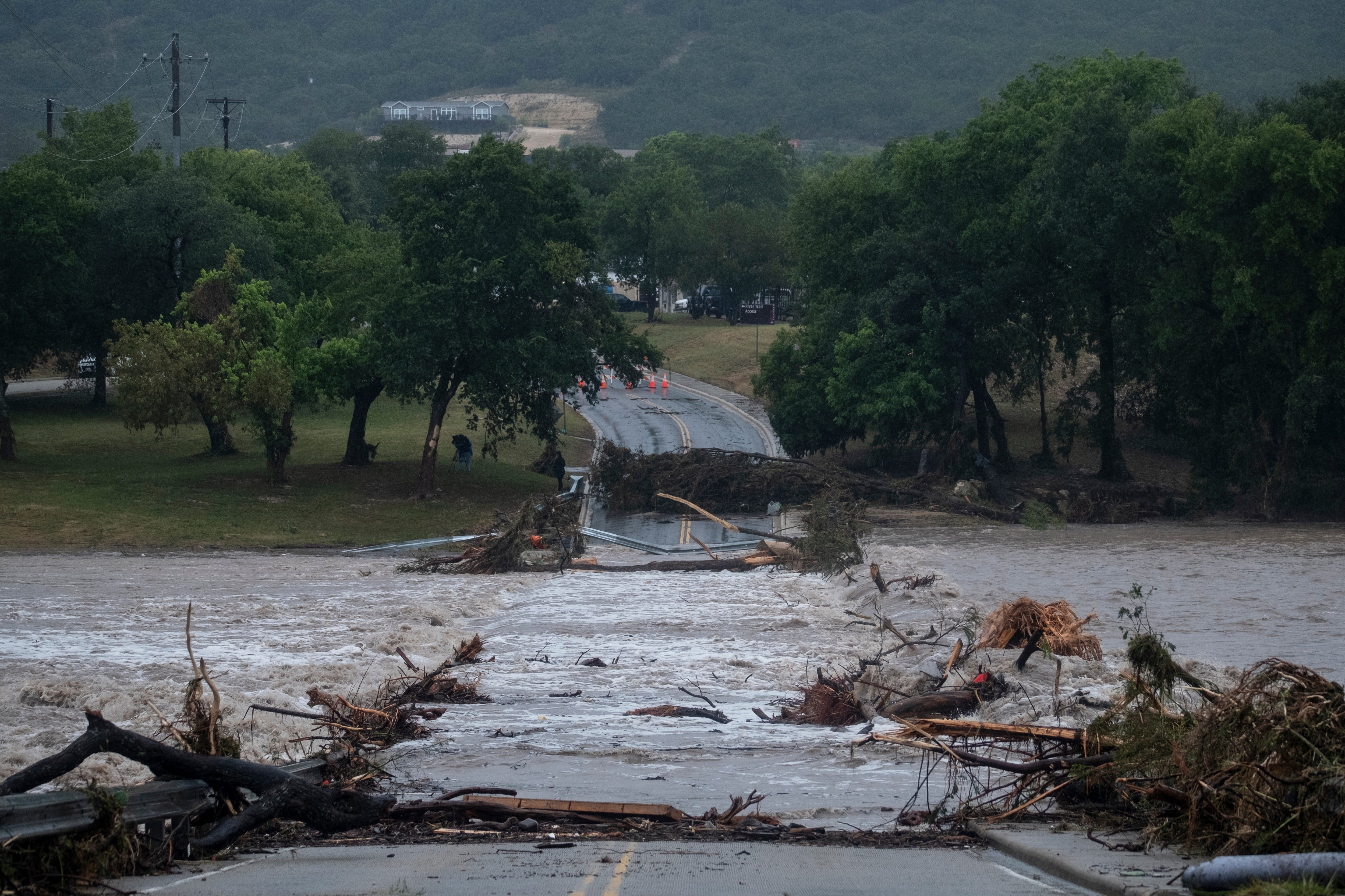 The confirmed fatalities include one person swept away near Uvalde while driving on a flooded road and a man who died after his mobile home was carried into Goat Creek on the Guadalupe River (AP Photo/Joel Angel Juarez)