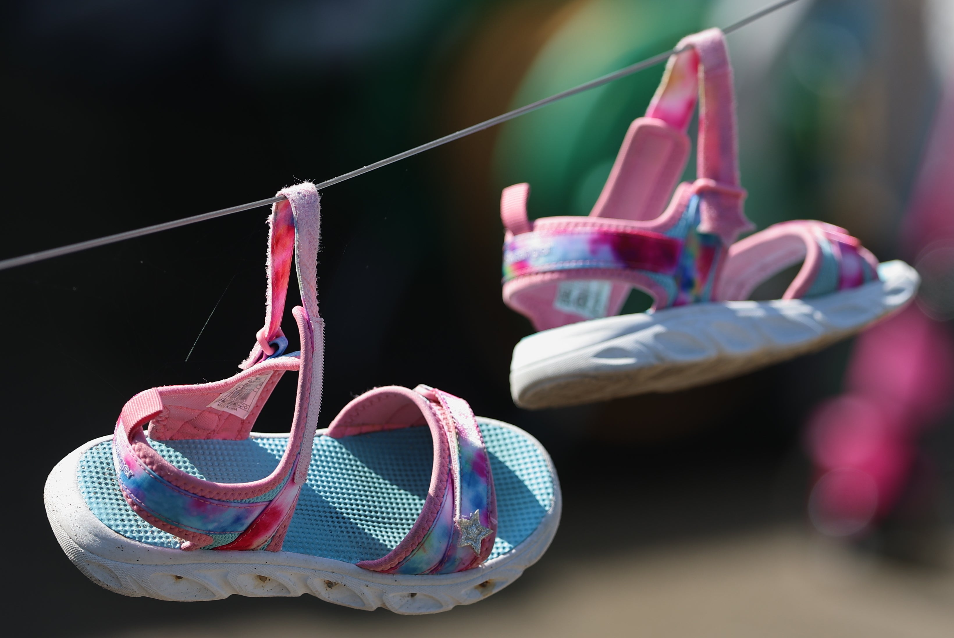 A pair of sandals on a washing line at the scene in the Old Cullybackey Road area of Ballymena (Liam McBurney/PA) (PA Wire)