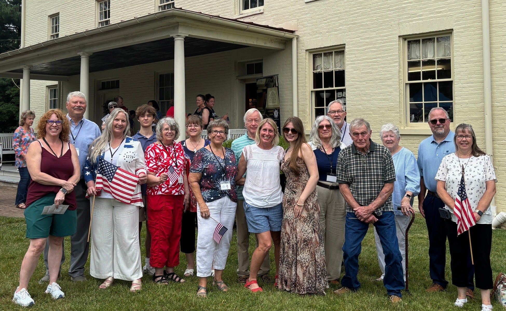 Relatives of Revolutionary War Pvt. John Pumphrey pose for a photo outside the 19th century Benson-Hammond House in Linthicum Heights, Md., on June 18, 2026