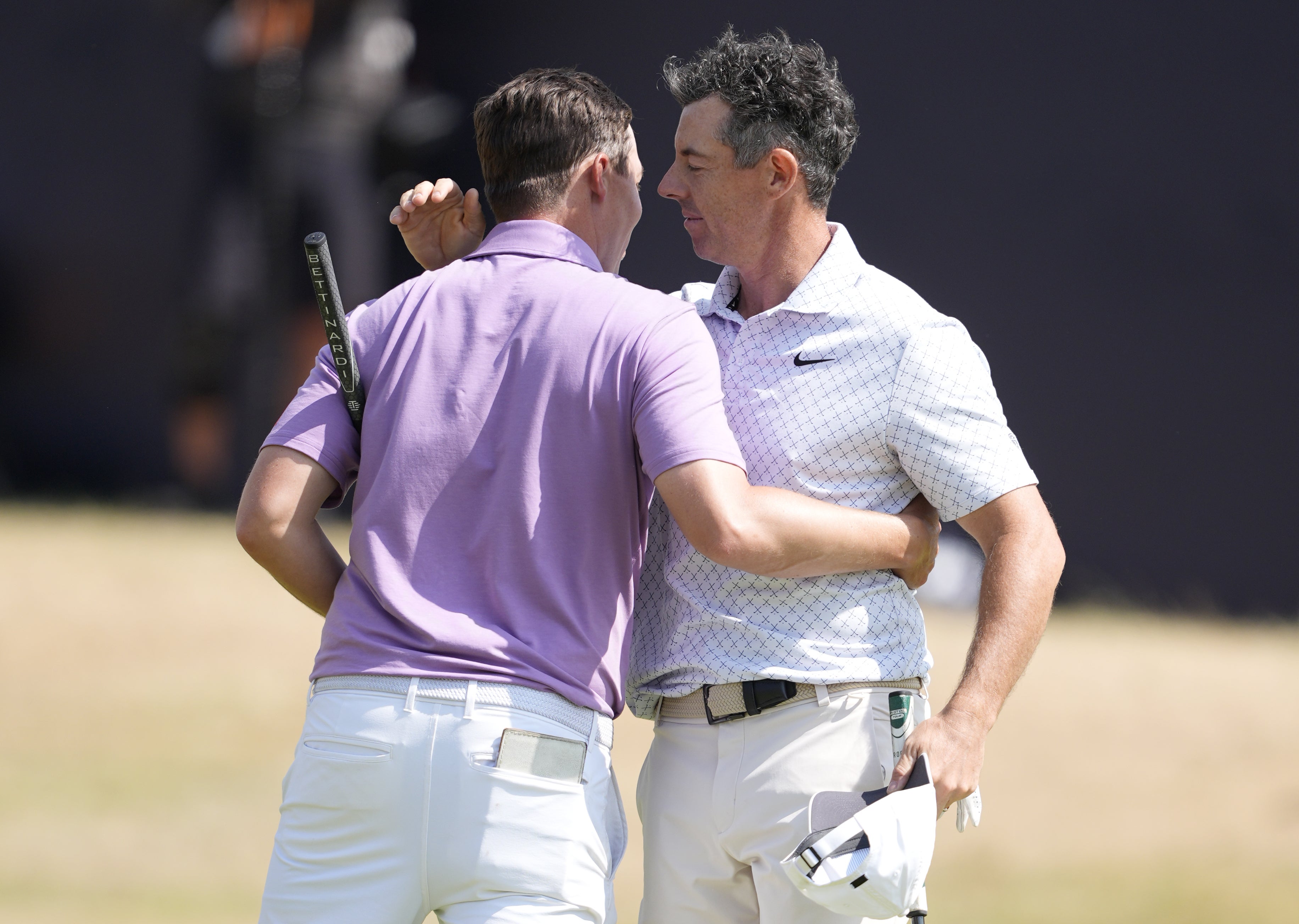McIlroy (right) and Alex Fitzpatrick embrace after completing their rounds (Peter Byrne/PA) (PA Wire)