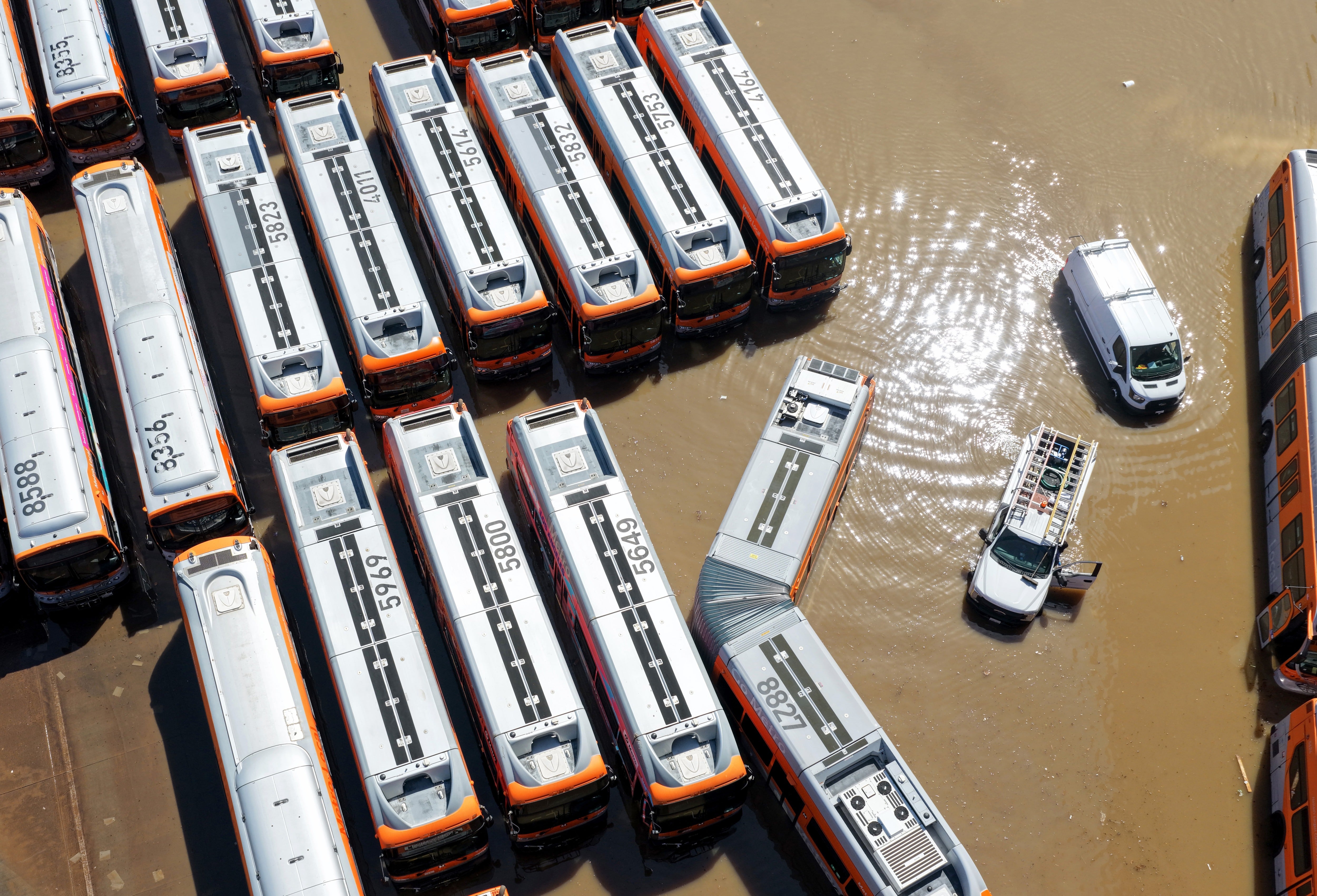The rupture led thousands of gallons of water to cascade down the streets of West Hollywood, leaving a fleet of buses submerged (Getty Images)