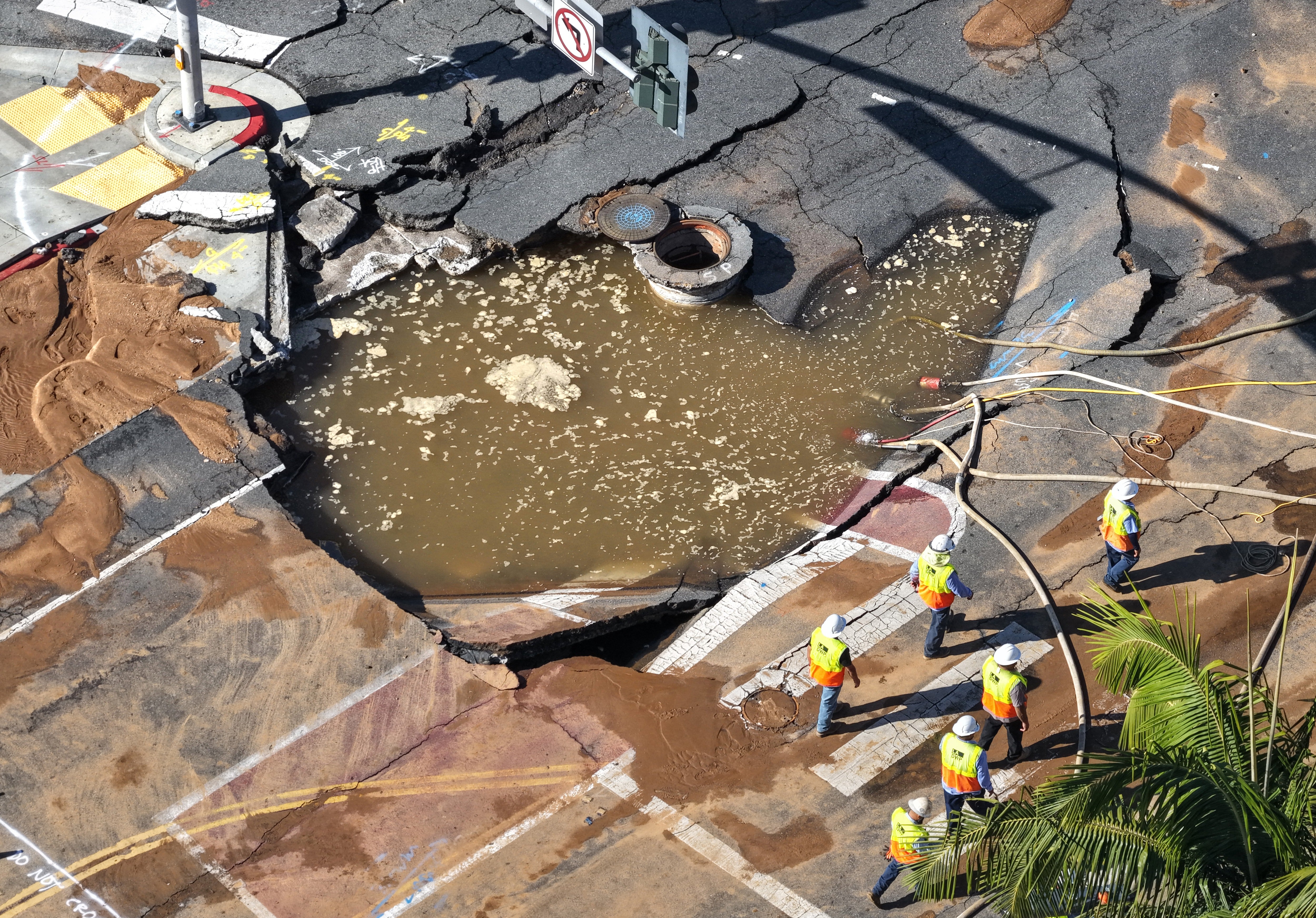 The sinkhole, located at the convergence of Sunset and Holloway Drive, contained about 195,000 gallons of water, officials said. (Getty Images)