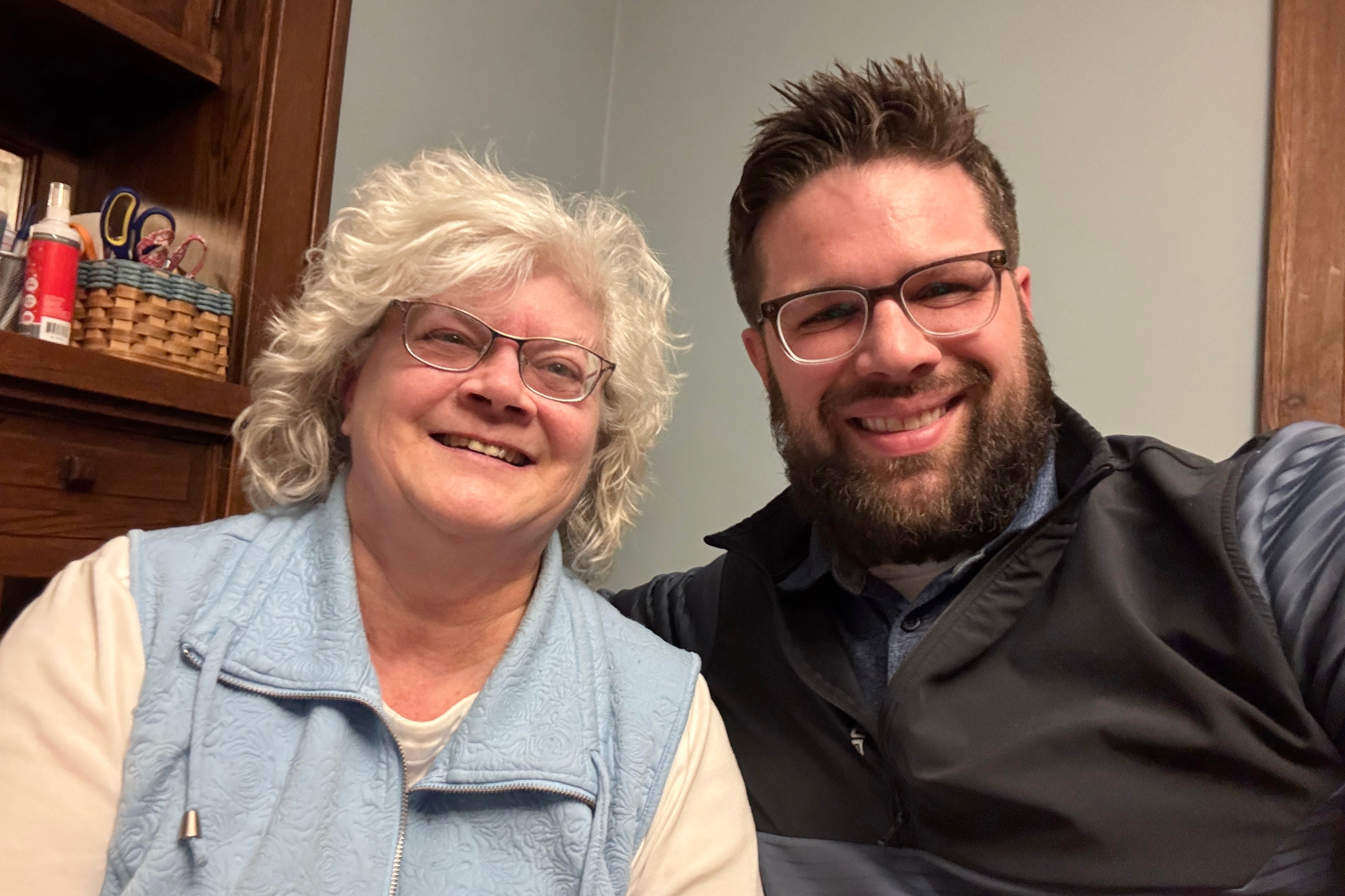 This photo provided by Kyle Bylin shows him with his biological mother, Liz O'Toole