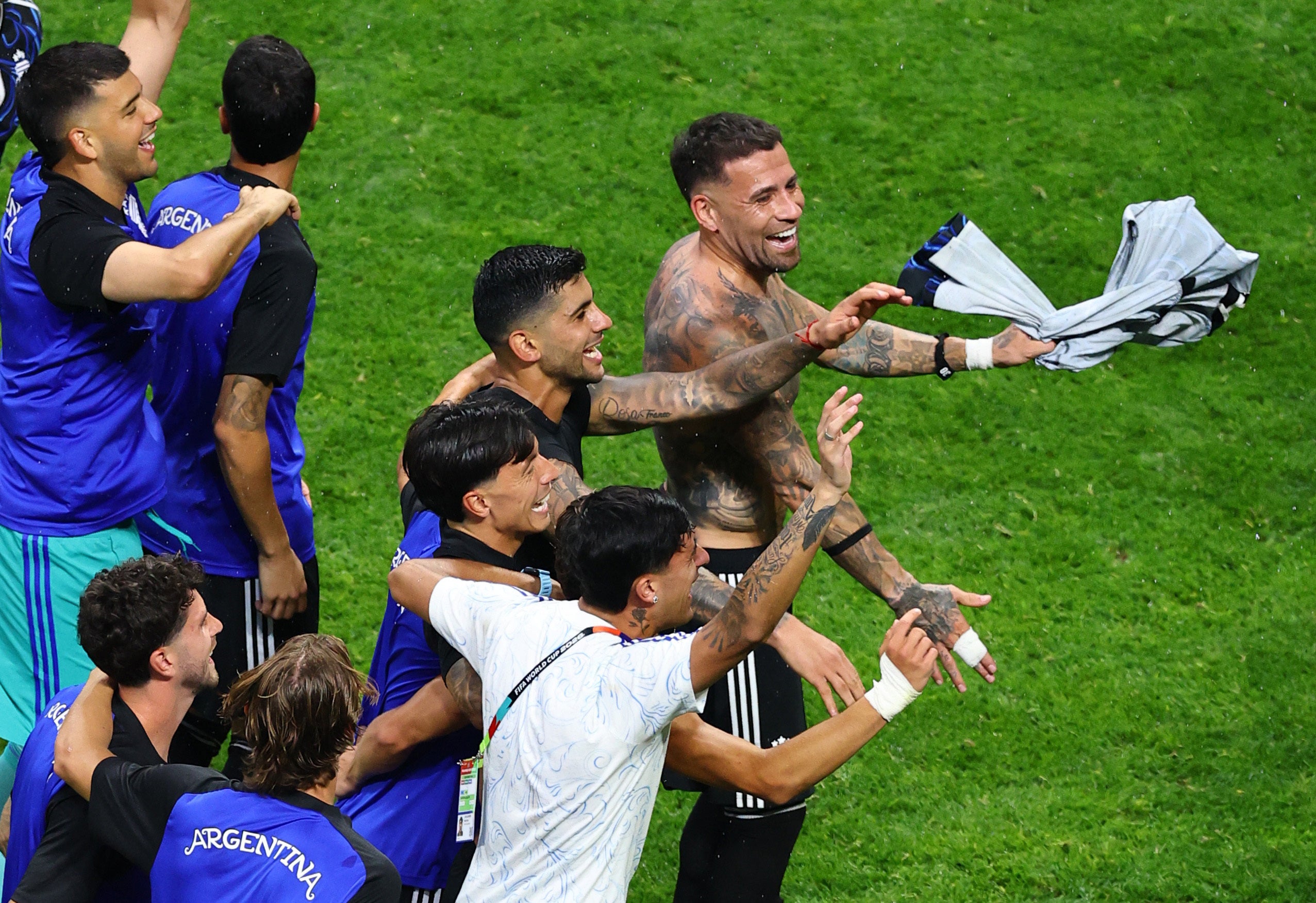 Argentina’s Lisandro Martinez, Cristian Romero and Nicolas Otamendi celebrate (Reuters)