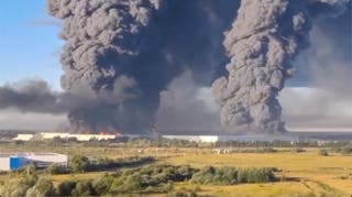 Smoke billows from the warehouse in Elektrostal, Russia