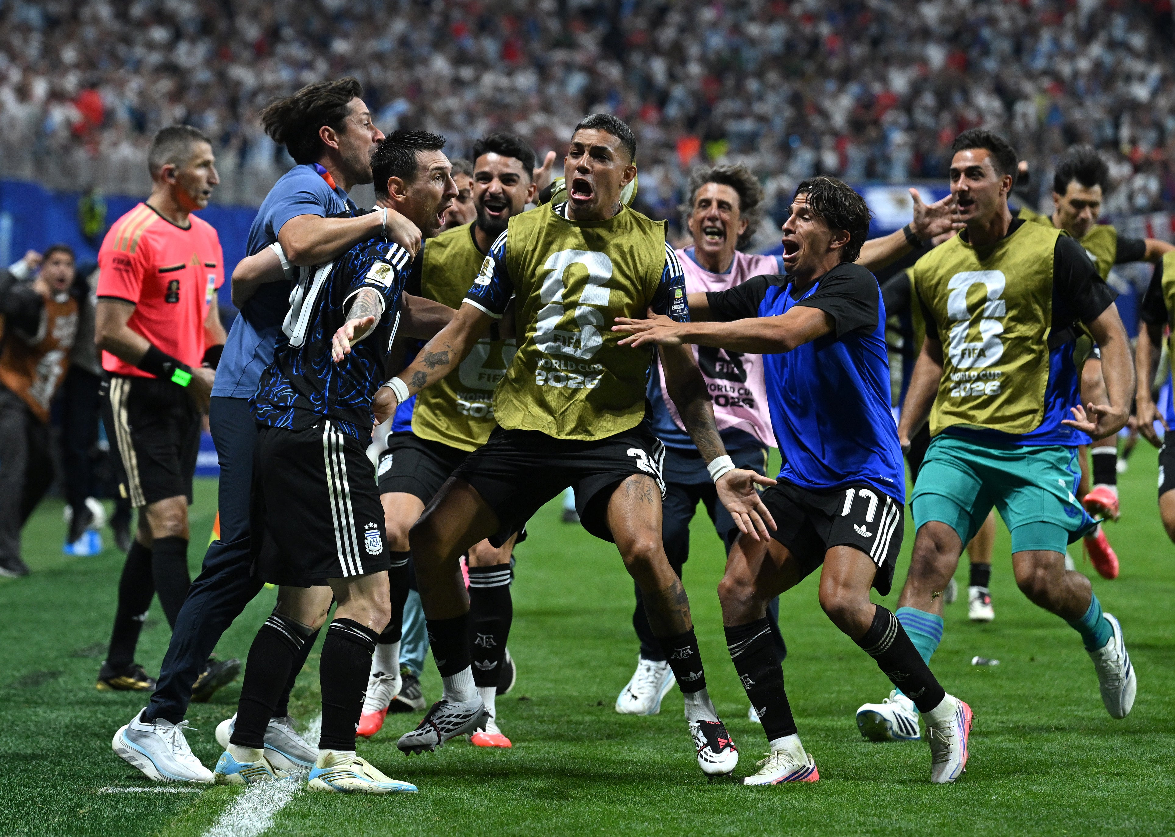 Lionel Messi of Argentina celebrates with teammates after crossing the ball for the team's second goal by Lautaro Martinez (Getty)