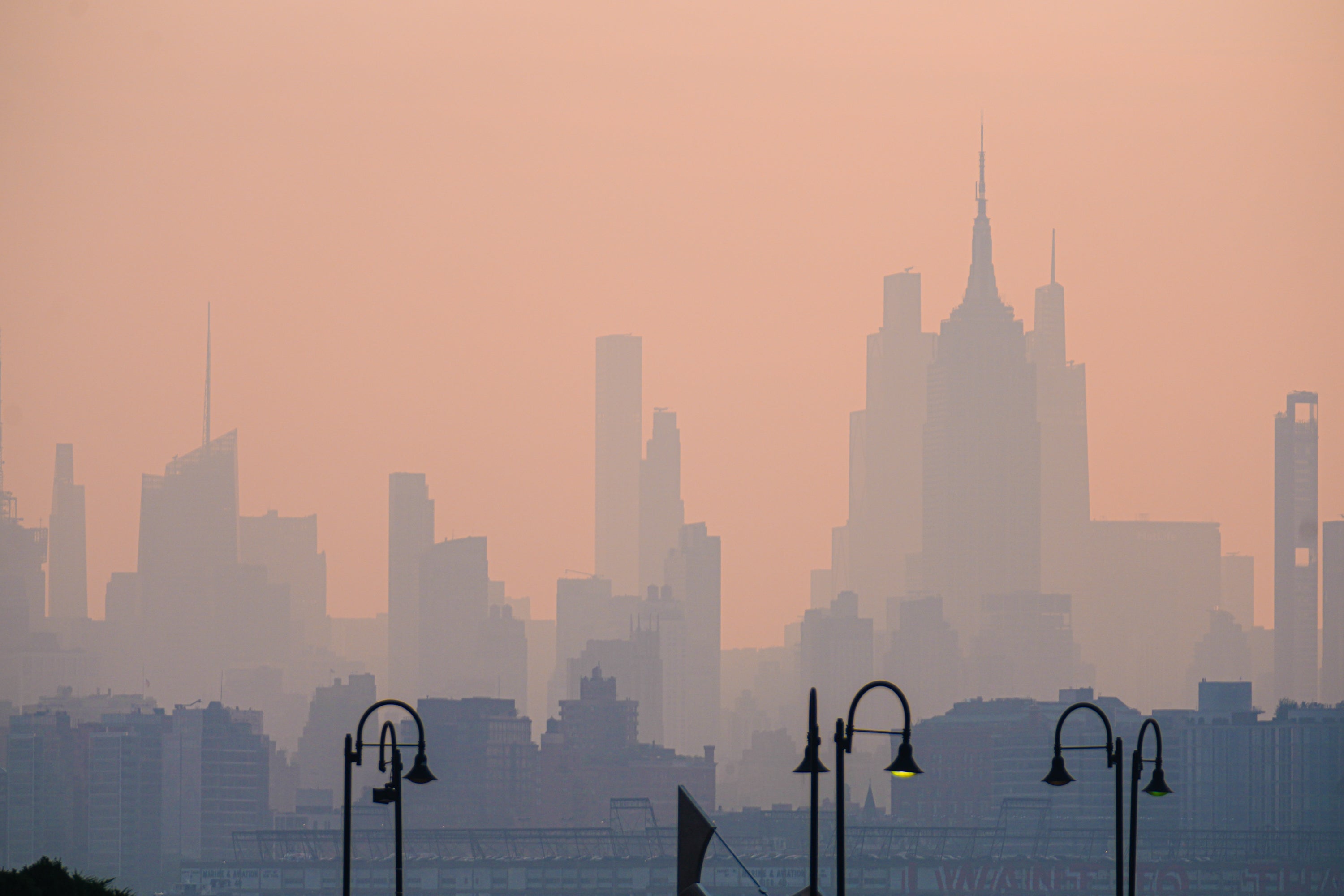 The New York City skyline is seen through a cover of wildfire smoke, in Jersey City, N.J., on Friday, July 17, 2026