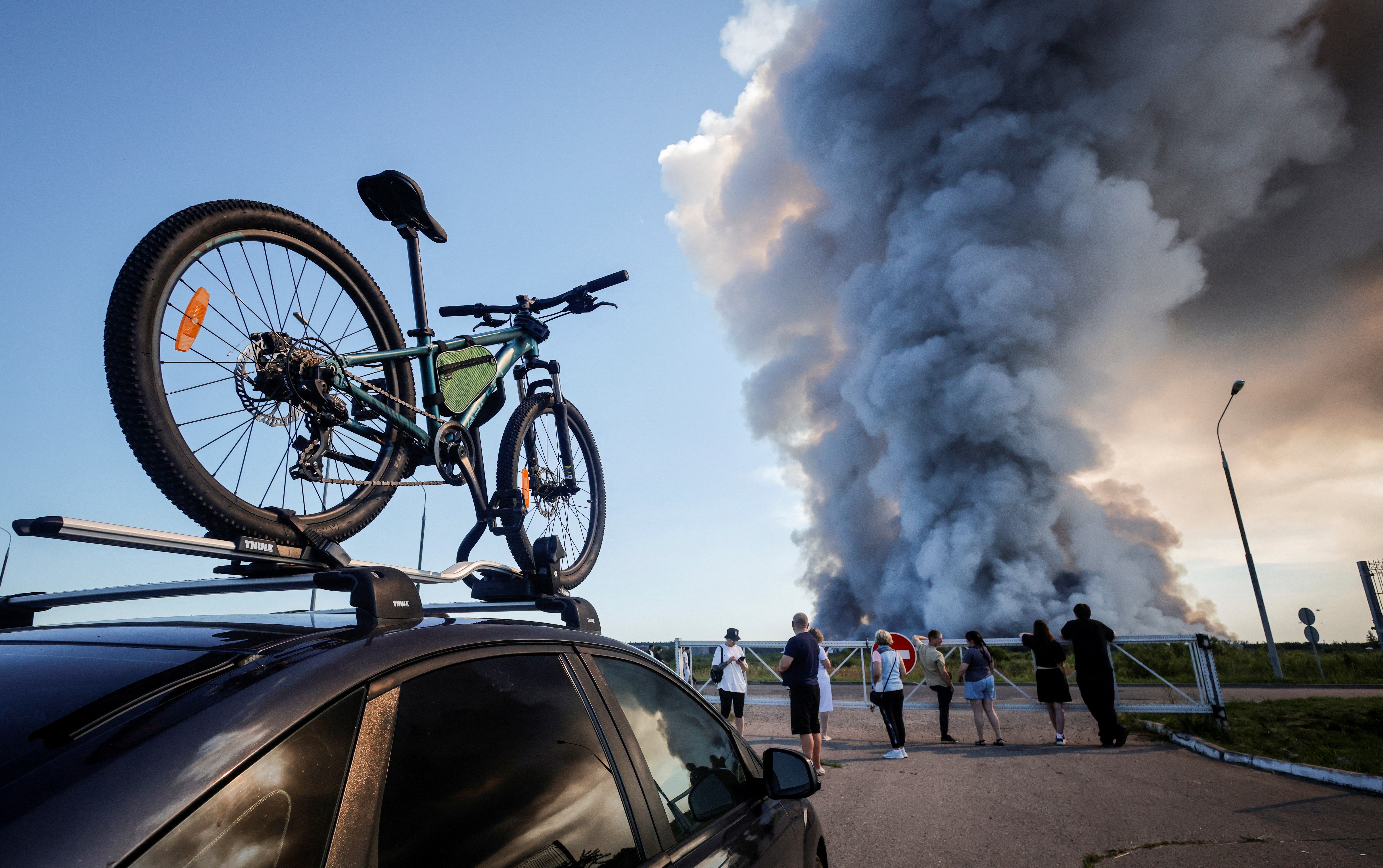 Bystanders watch the fire at the Wildberries complex