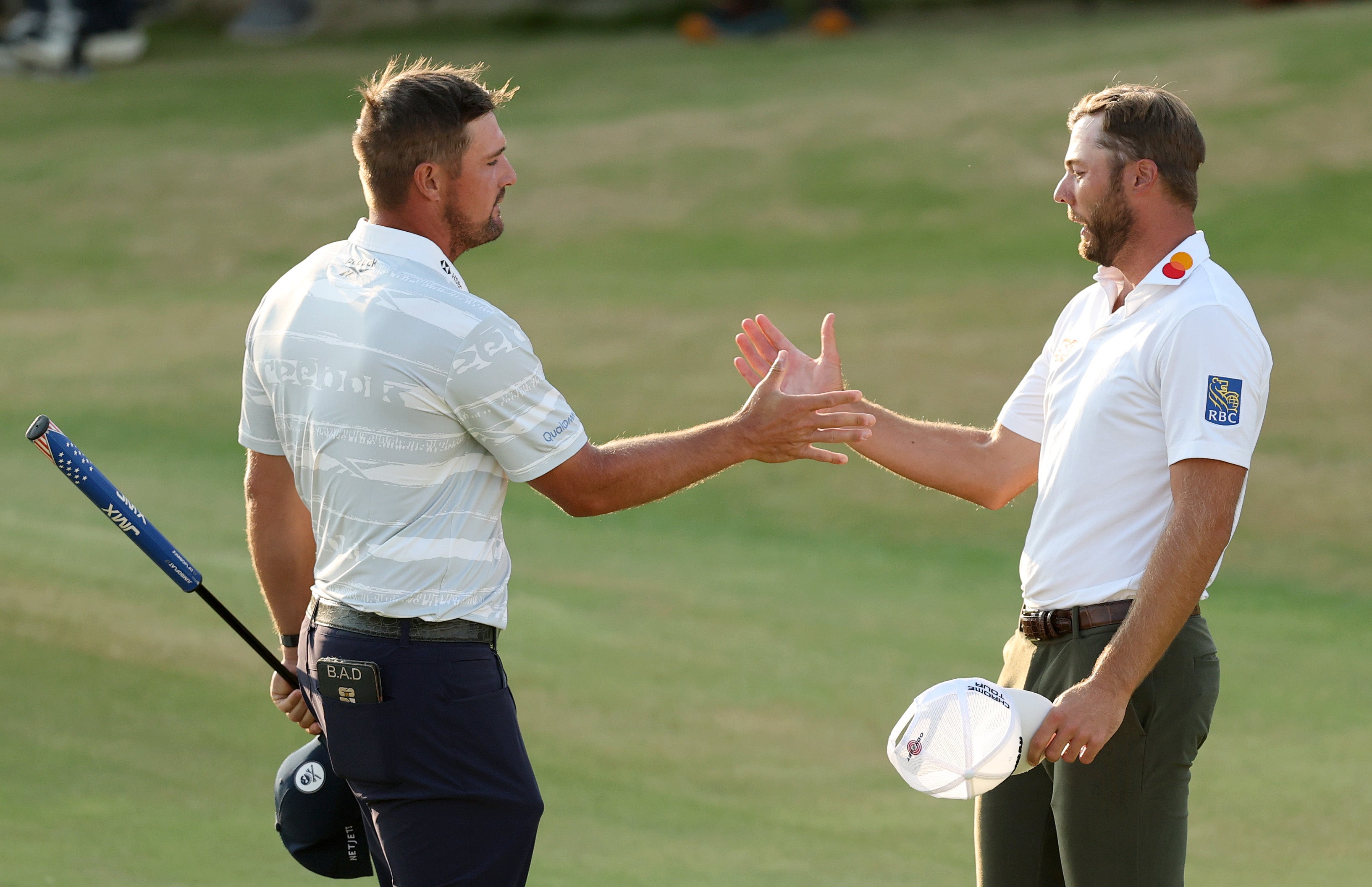 Sam Burns (right) leads The Open but Bryson DeChambeau (left) again stole the headlines