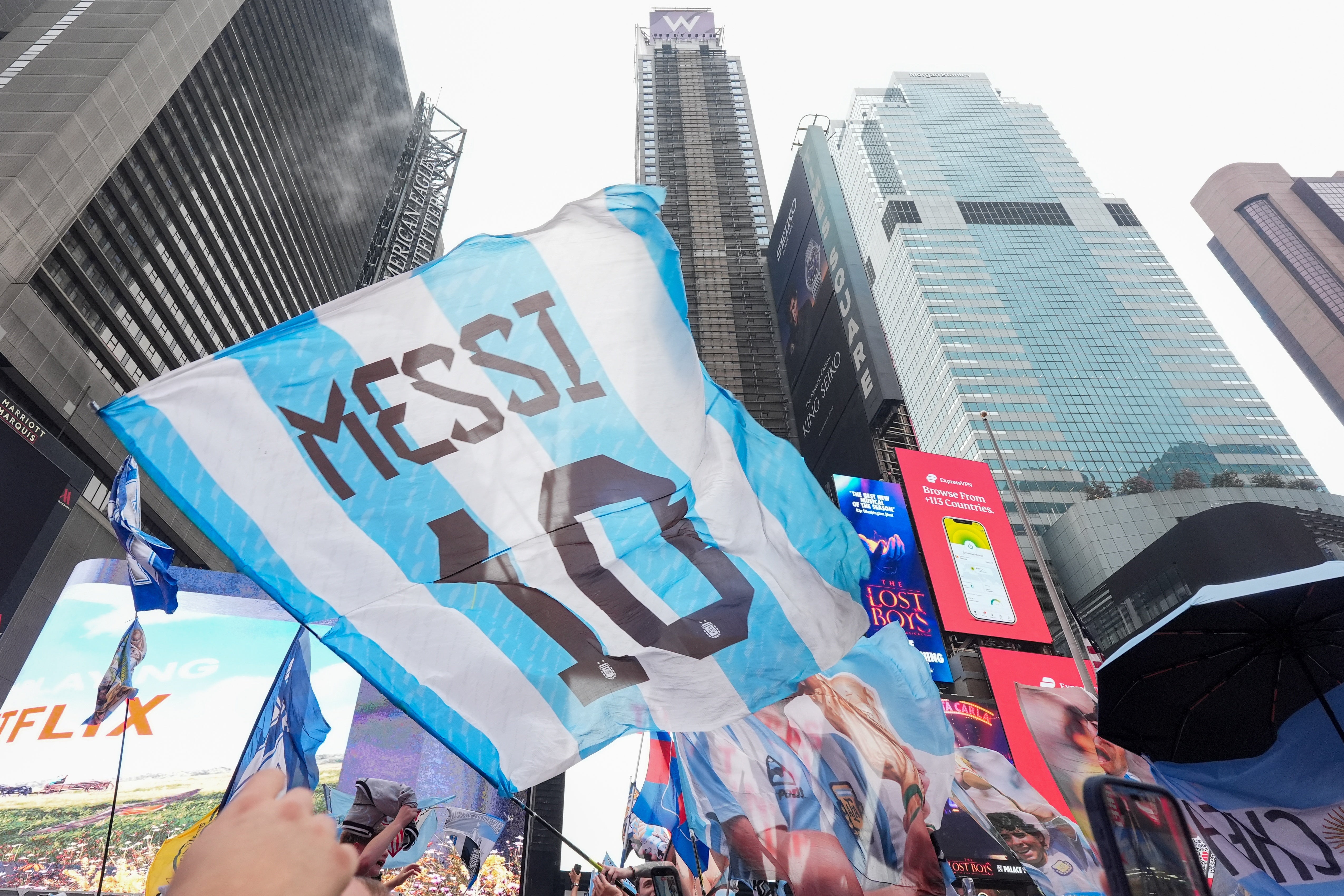 Argentina fans gather for a rally on the eve of the World Cup final soccer match in New York's Times Square