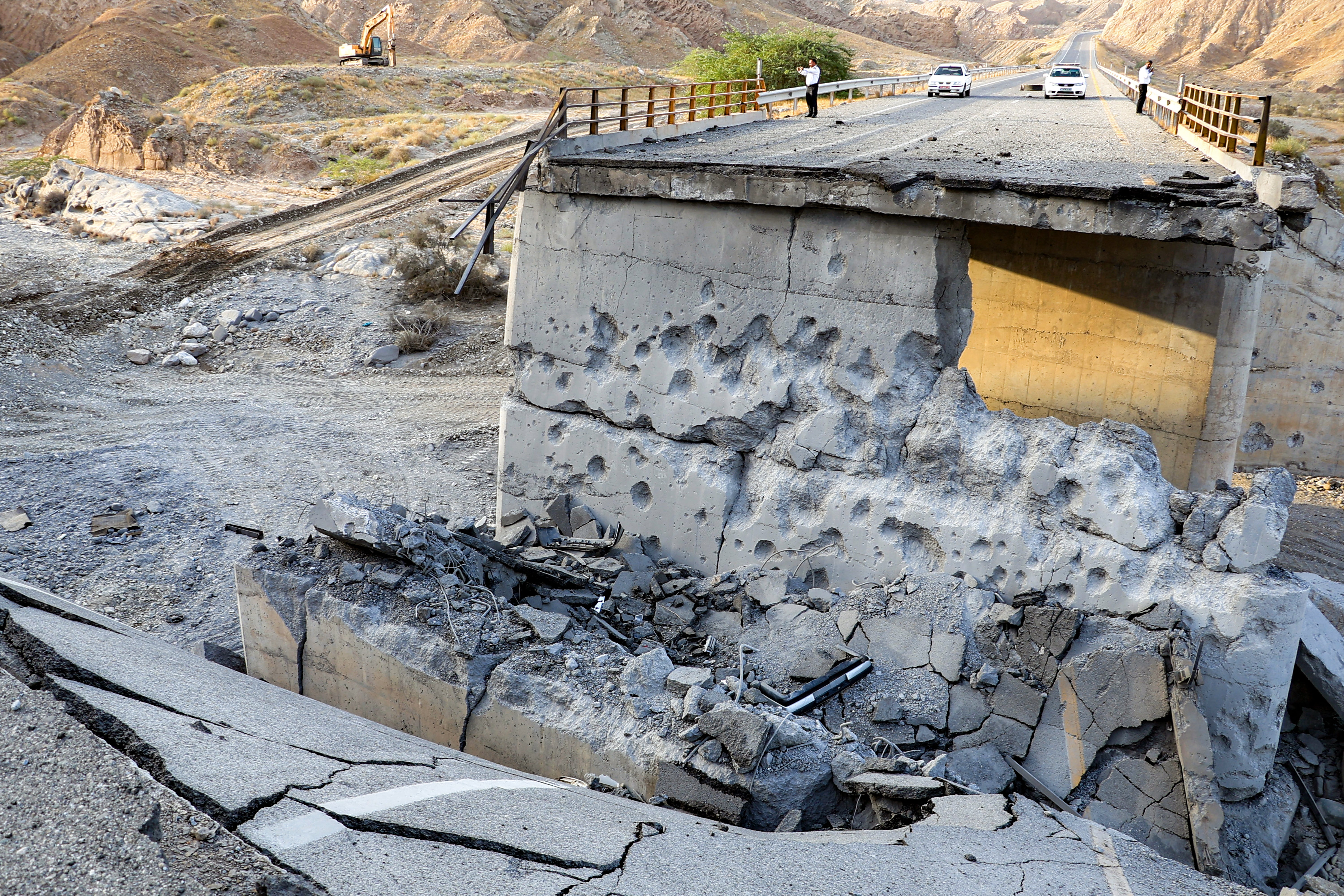 A heavily-damaged bridge which was hit by a US strike is pictured along the road connecting Roudan and Bandar Abbas in southern Iran on July 18, 2026. (AFP/Getty)