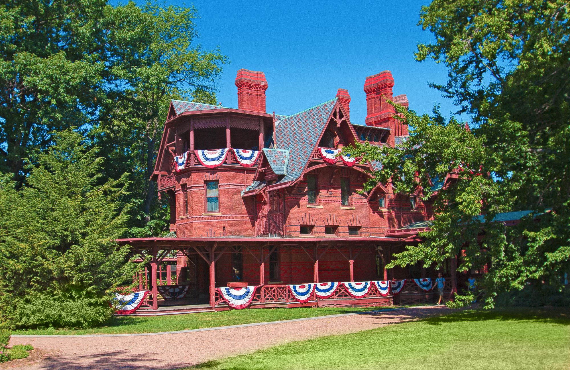 Mark Twain’s house is defined by its red brick, ornate chimneys and playful gables