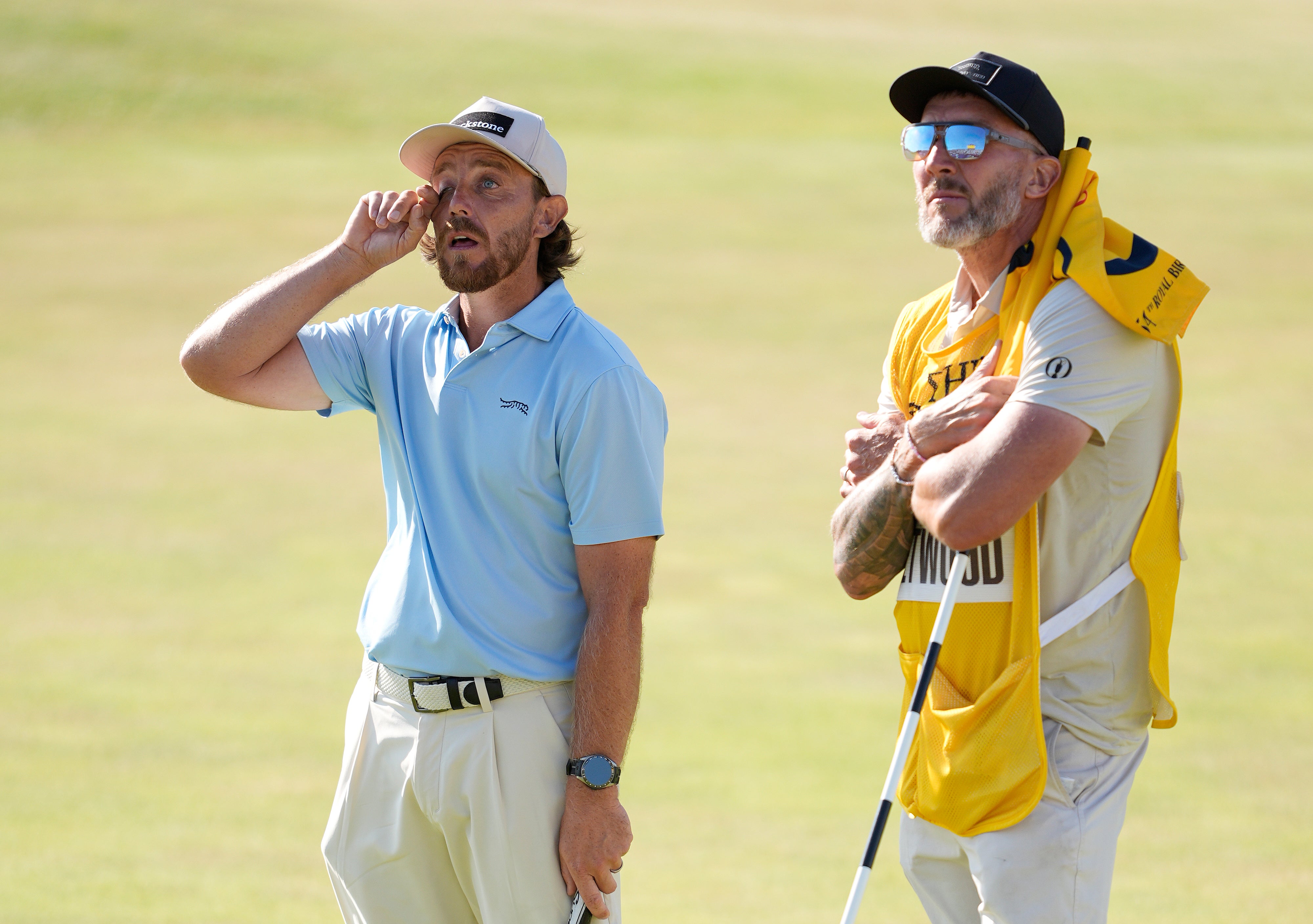 Tommy Fleetwood of England and caddie Ian Finnis on the 18th green