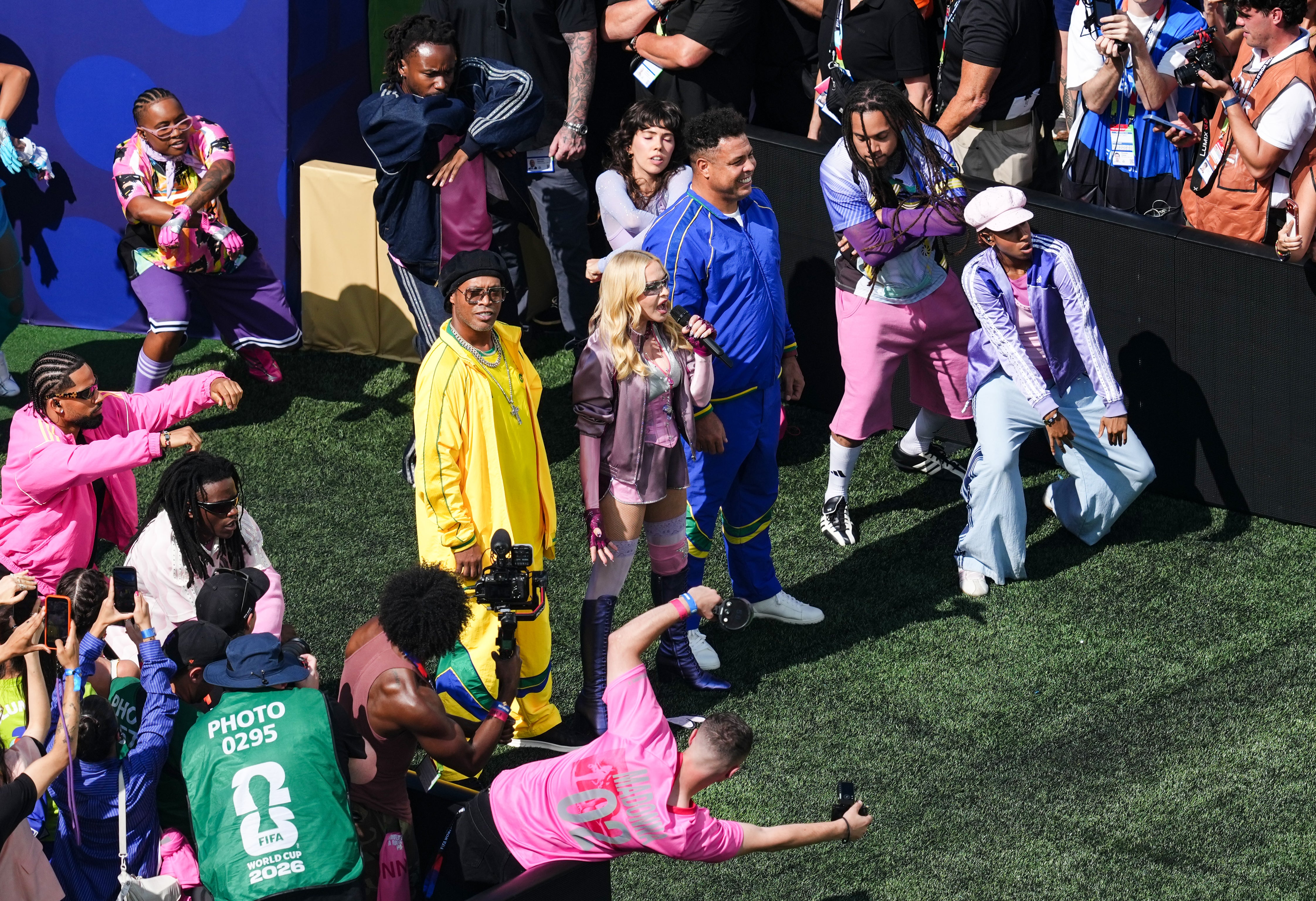 Ronaldinho and Ronaldo with Madonna during the half time show during the FIFA World Cup 2026 final (PA)