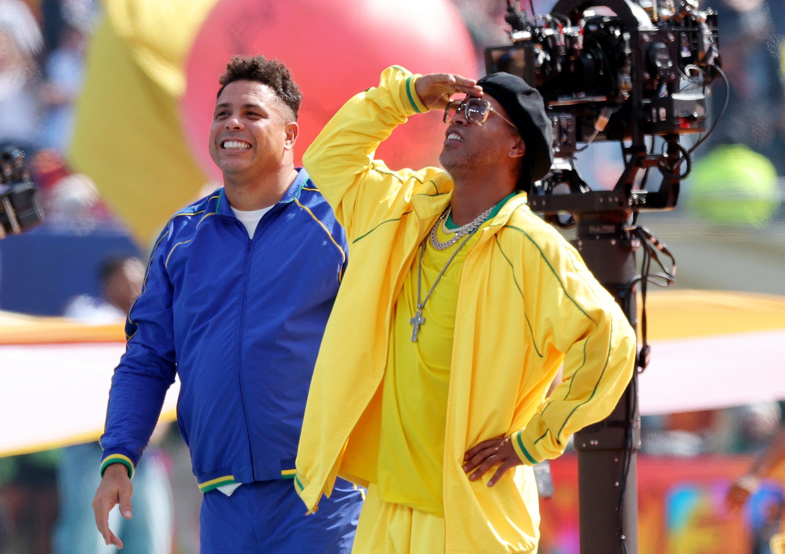Former Brazil players Ronaldo and Ronaldinho during the halftime show (Reuters)