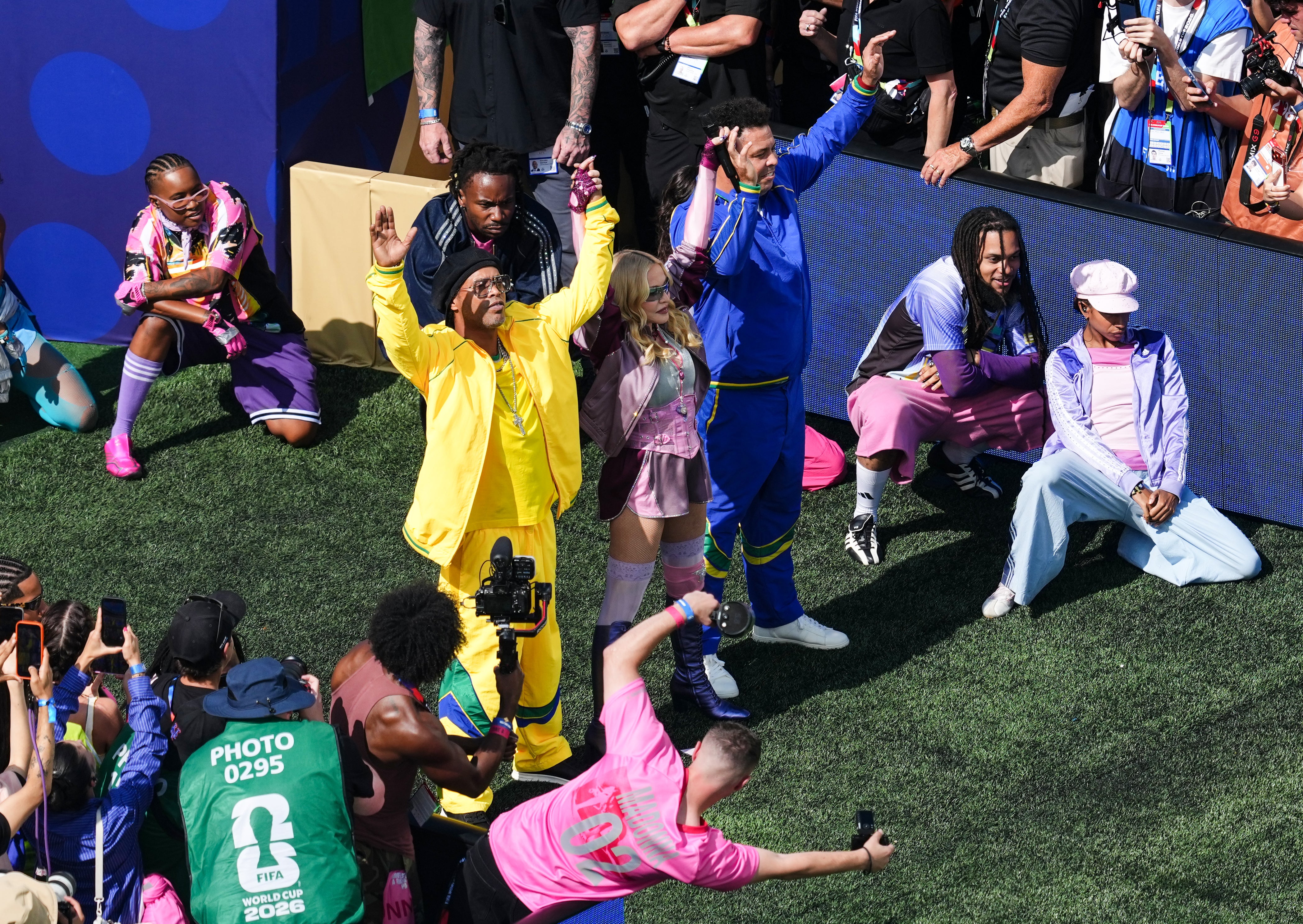 Ronaldinho and Ronaldo with Madonna during the half-time show (Martin Rickett/PA) (PA Wire)