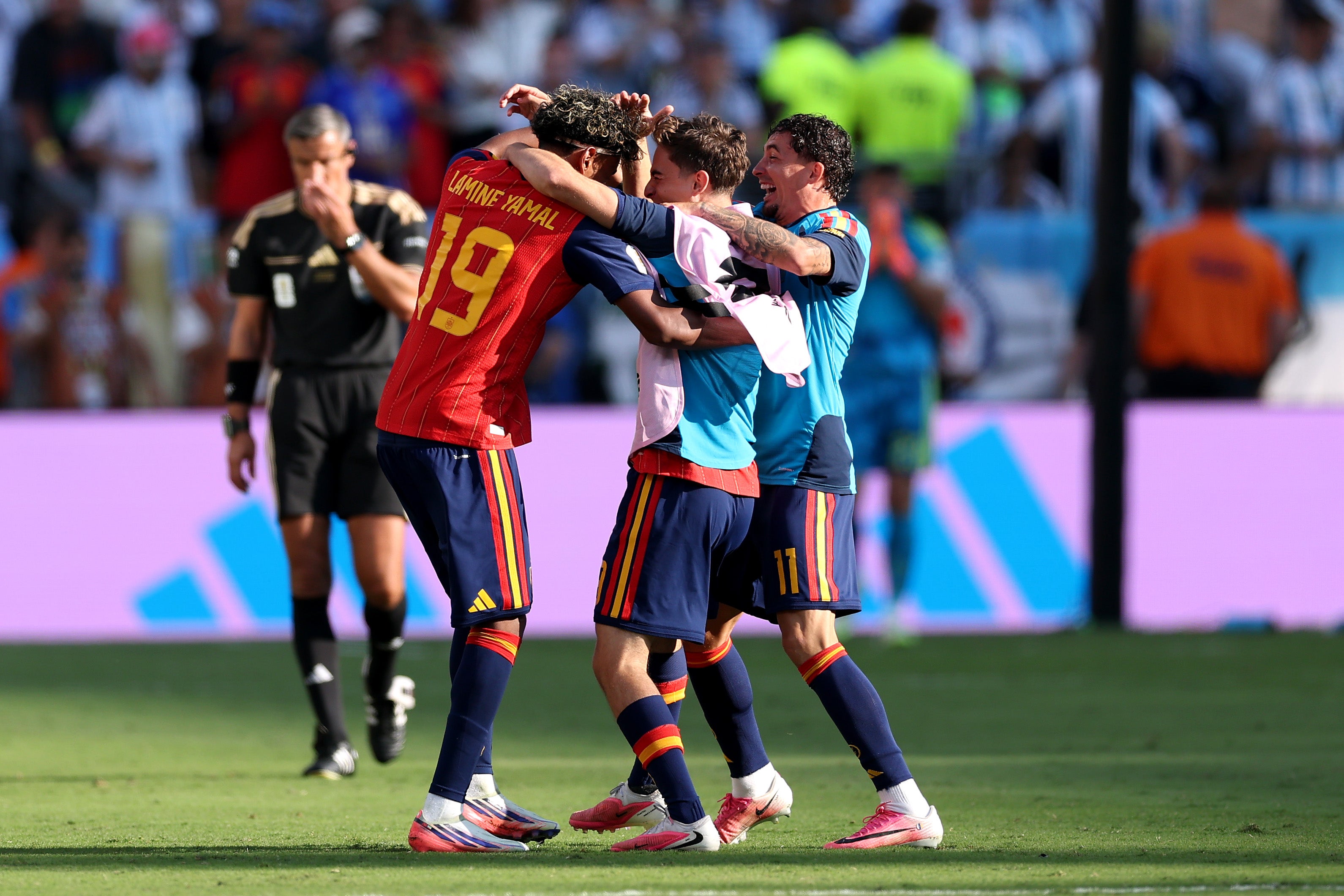 Lamine Yamal #19 of Spain celebrates with teammates